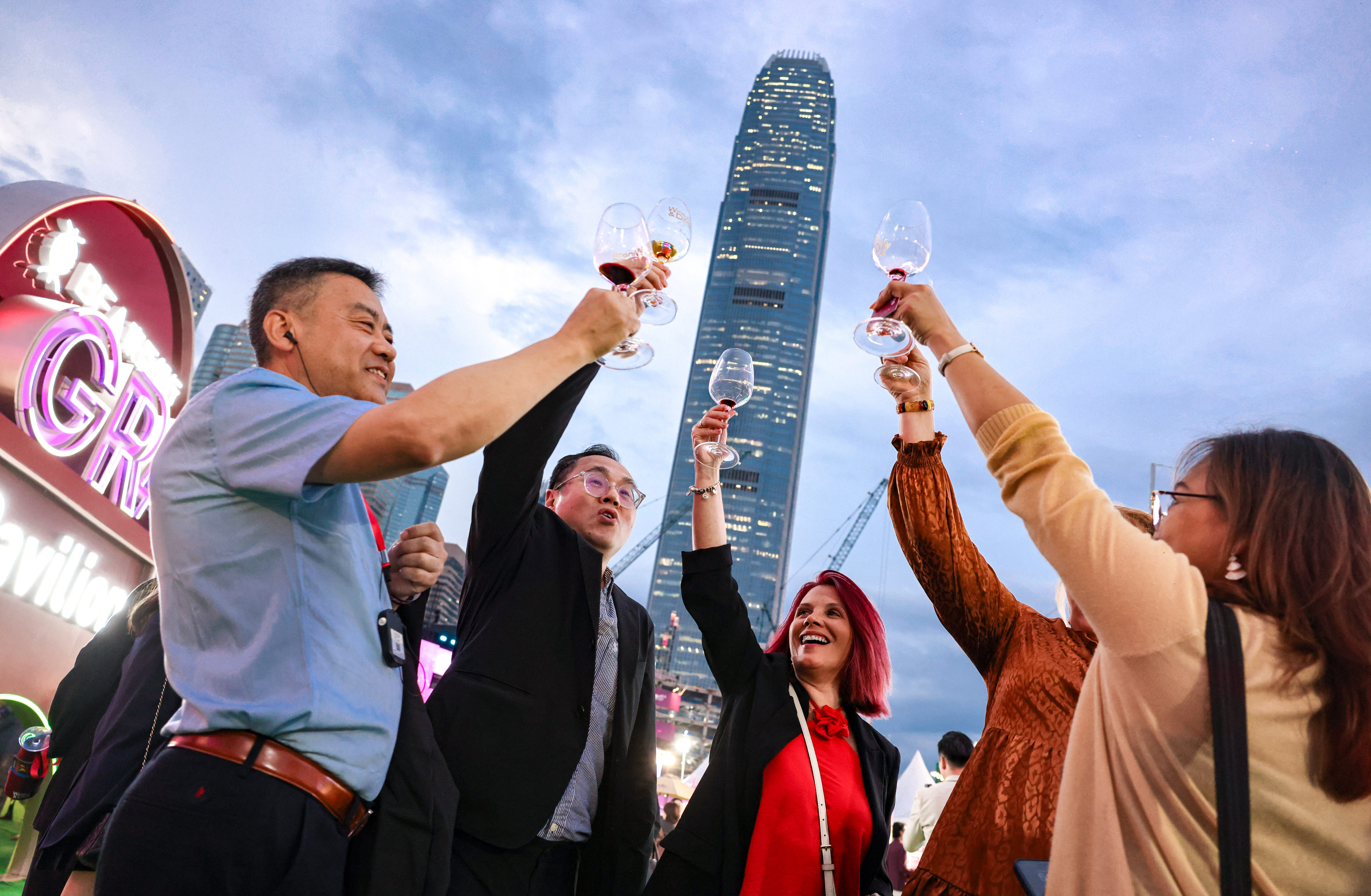 Revellers lift glasses as the Wine and Dine Festival at the Central Harbourfront Event Space on October 23. Photo: Nora Tam