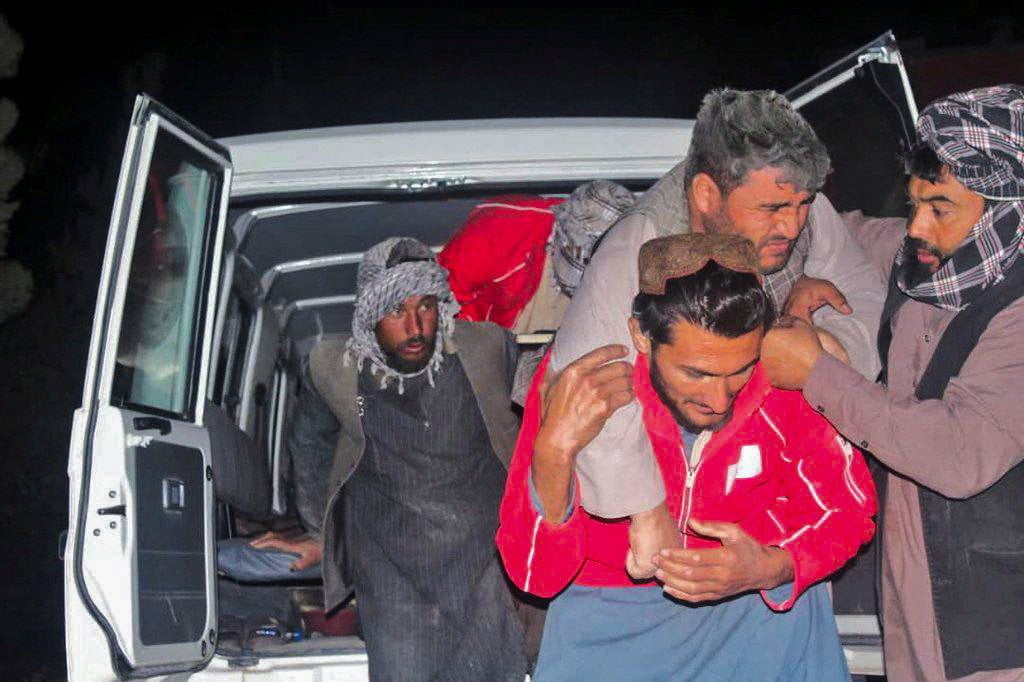 A man being carried out of a vehicle following the earthquake. Photo: Afghan Red Crescent via Reuters