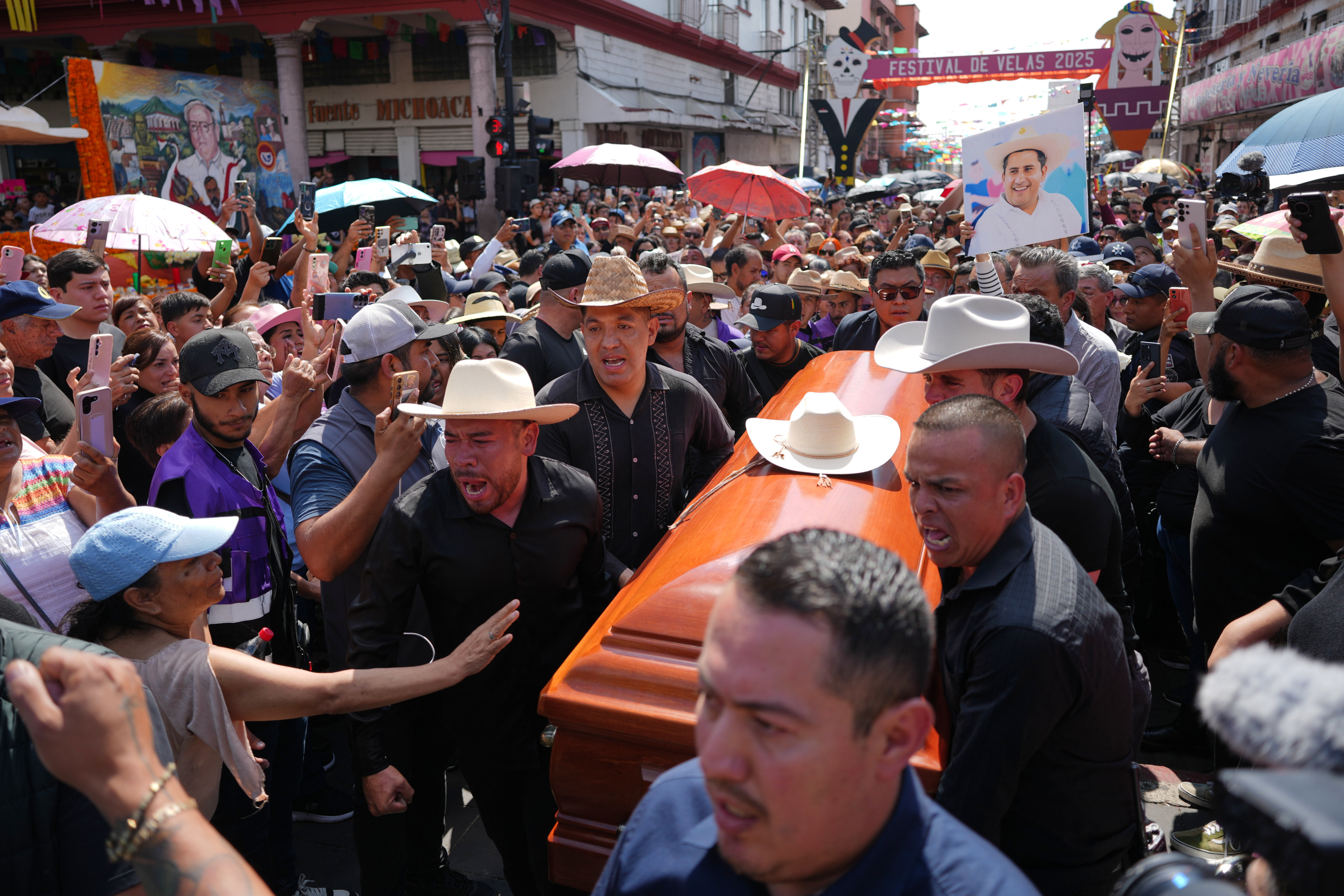 People carry the coffin of Carlos Alberto Manzo Rodríguez, who was shot during Day of the Dead celebrations. Photo: AP