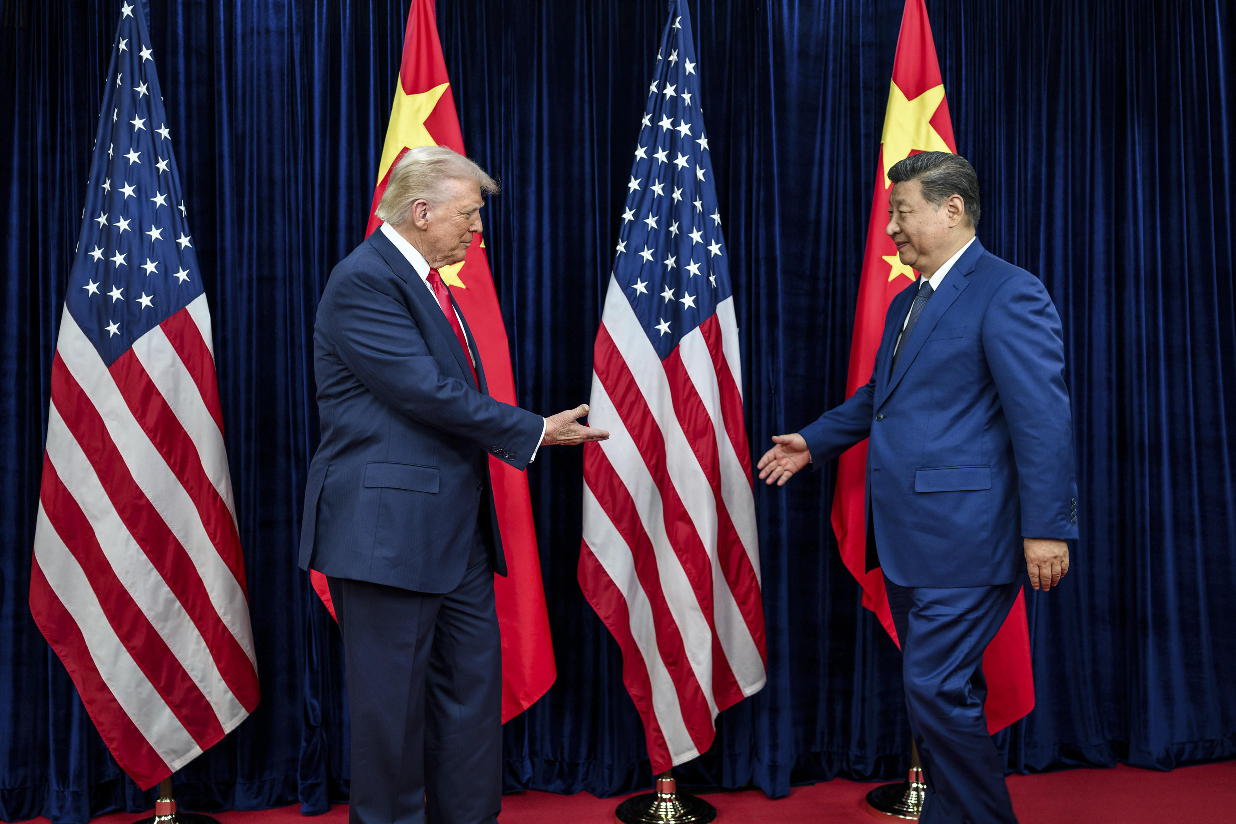 US President Donald Trump greets Chinese President Xi Jinping before their meeting in Busan, South Korea, on Thursday. Photo: White House/Planet Pix via ZUMA Press Wire/dpa
