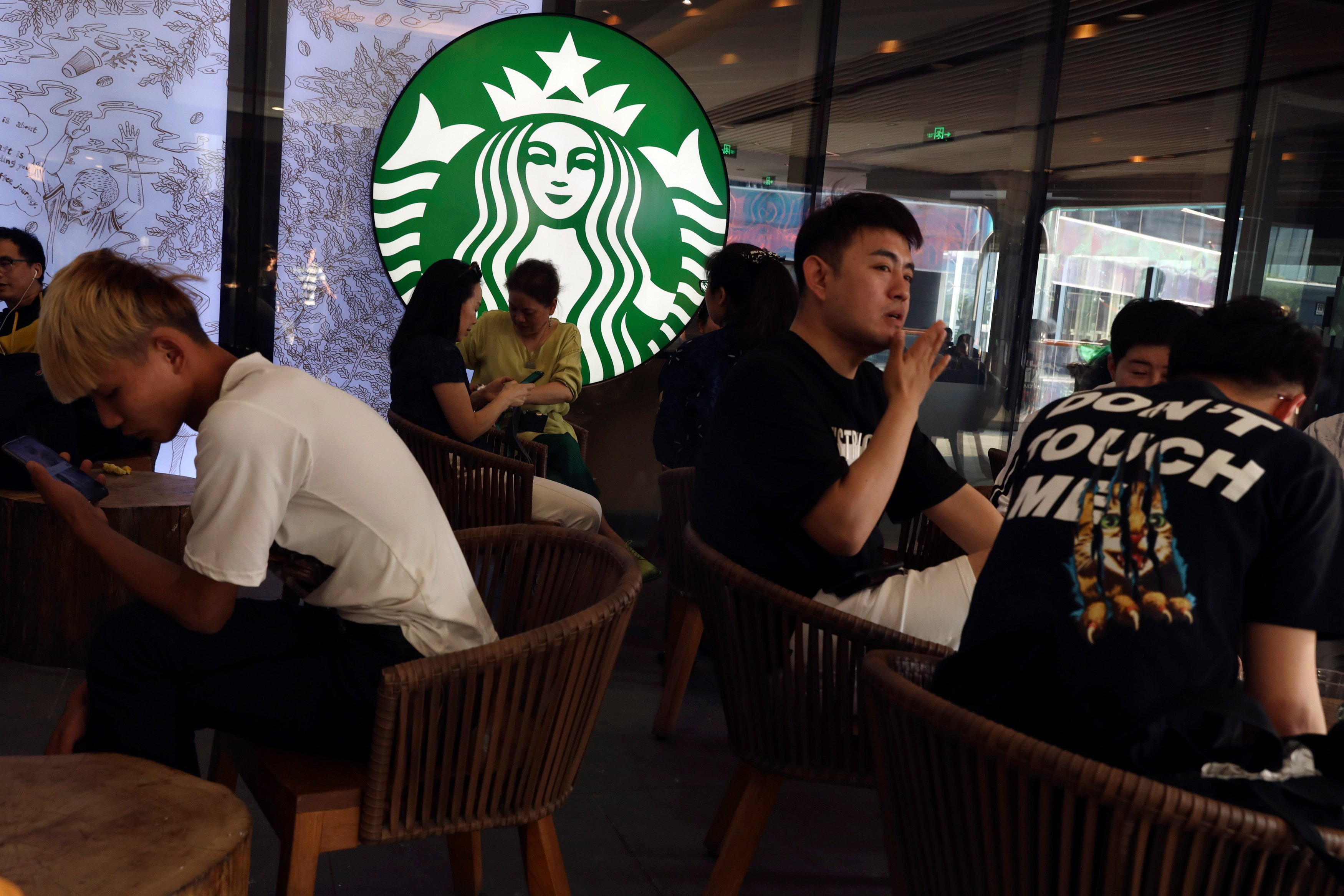 Customers sit in a Starbucks store in Beijing on May 10, 2019. Photo: AP Photo