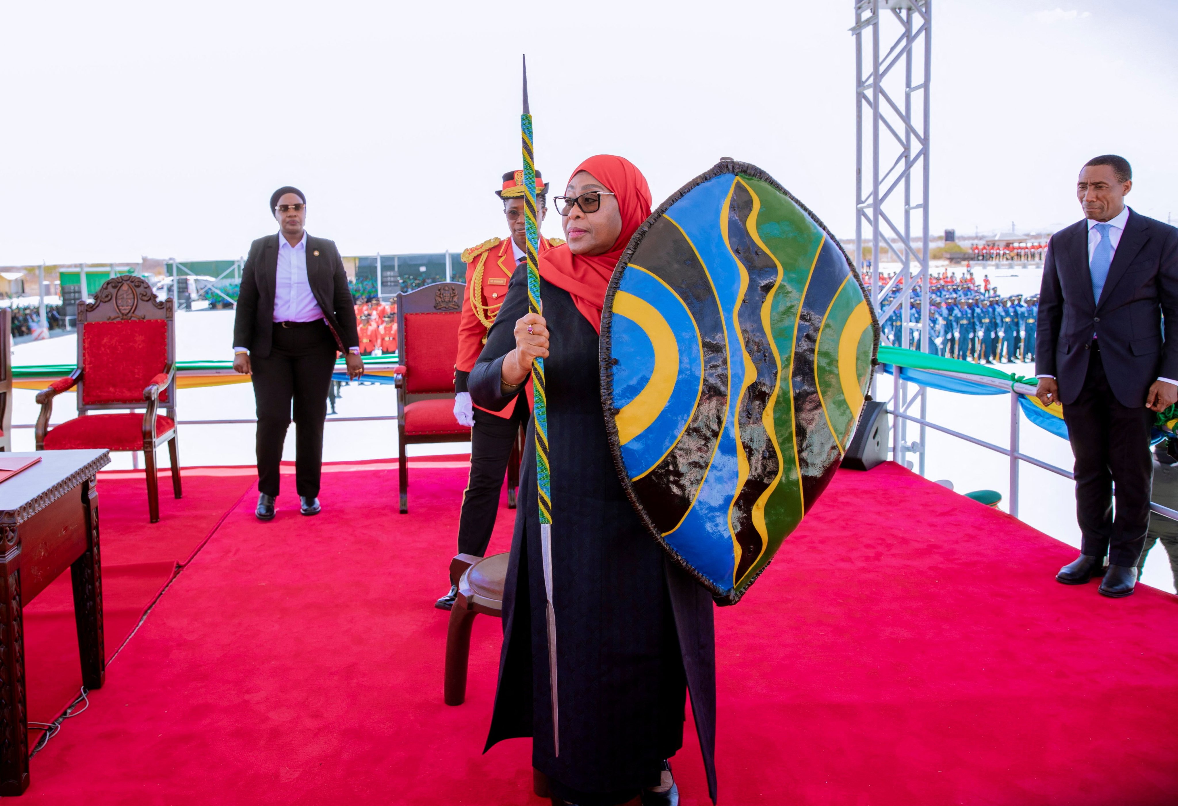 Tanzania’s President Samia Suluhu Hassan holds a spear and a shield during her swearing-in ceremony in Dodoma, Tanzania on Monday. Photo: Tanzania Presidential Press Unit via Reuters