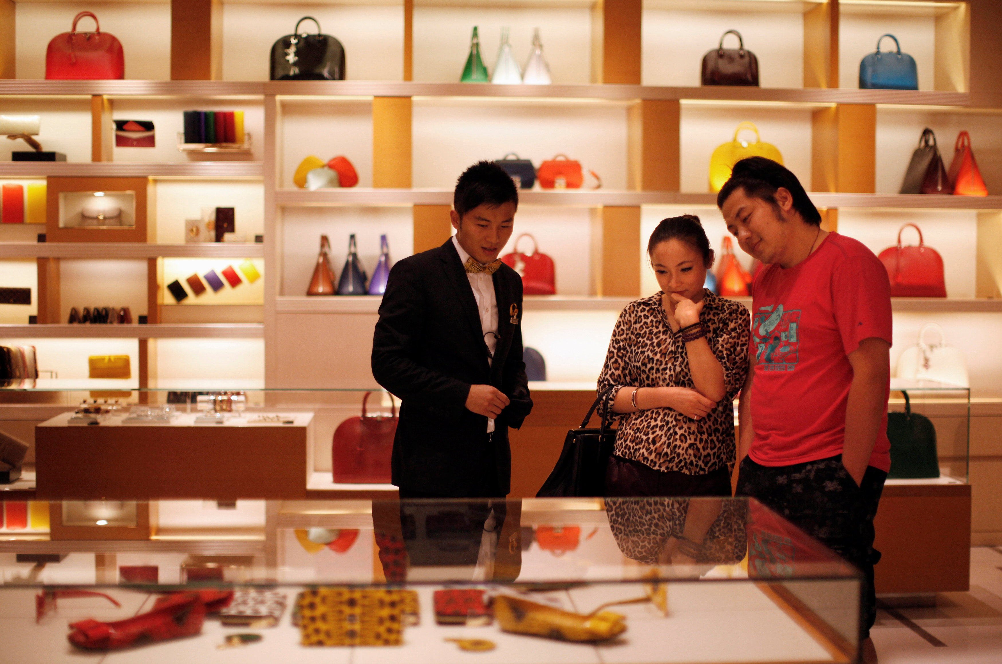 A couple shop at a Louis Vuitton store in Shanghai in 2012. Photo: Reuters