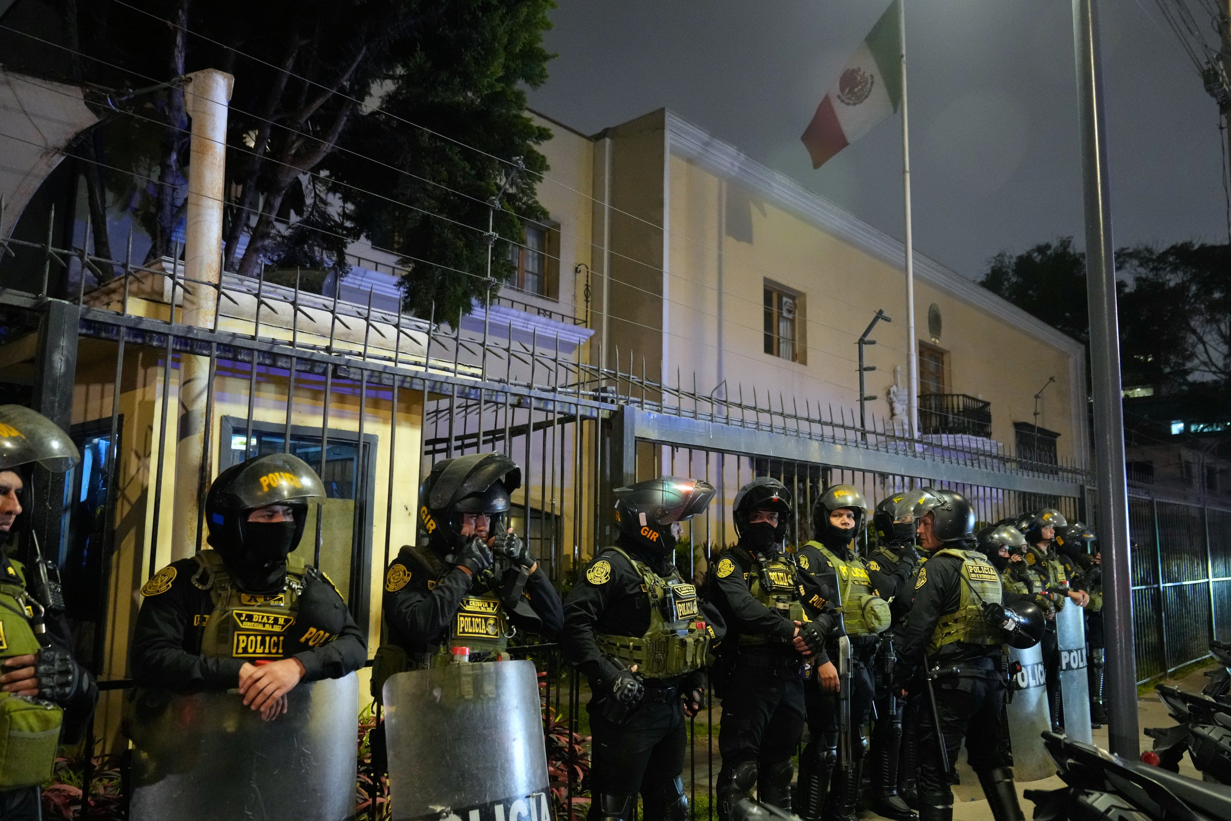 Police guard the Mexican embassy in Lima, Peru, on Monday. Photo: AP