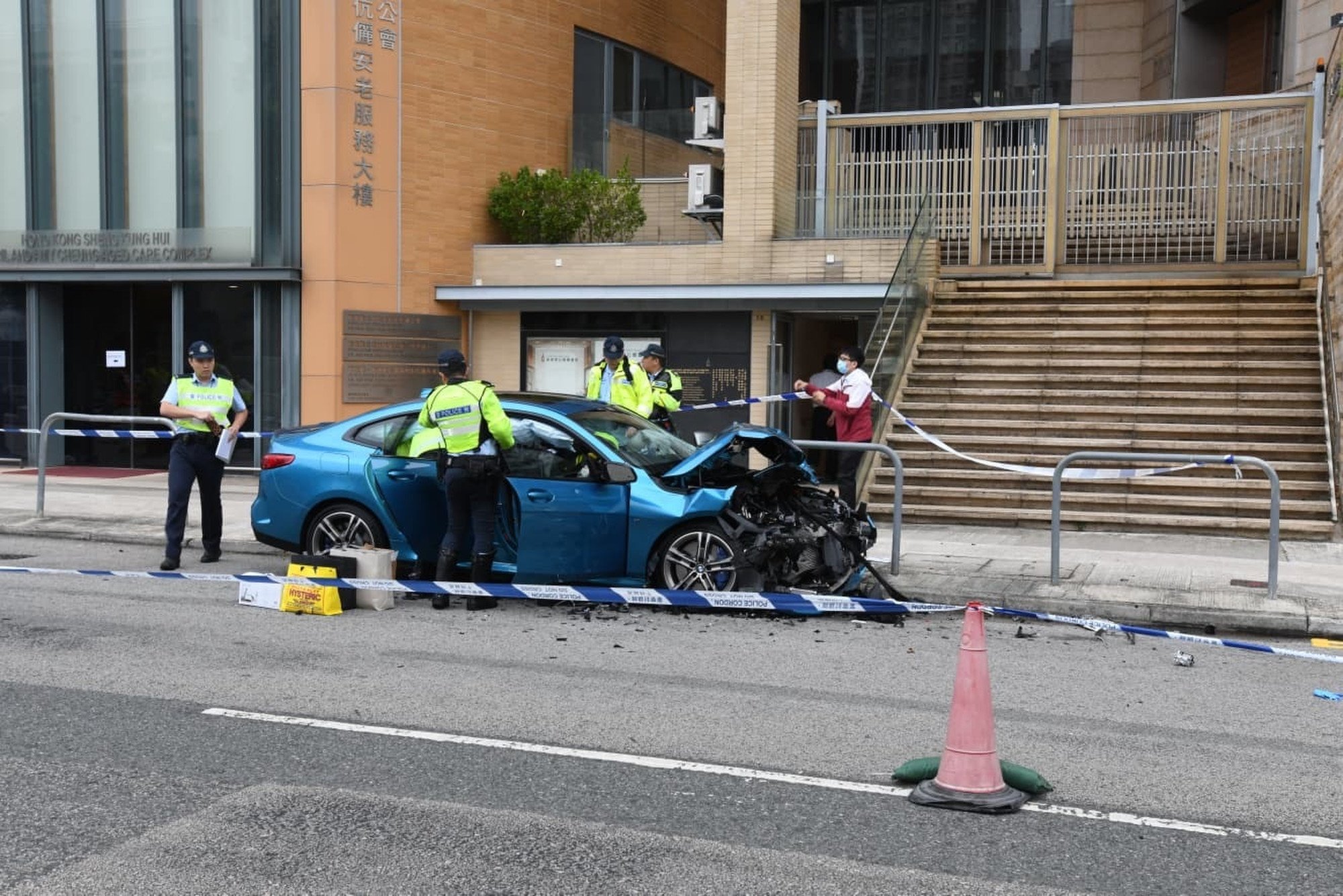 Police have arrested the male driver of the blue BMW, which was severely damaged in the accident. Photo: Handout