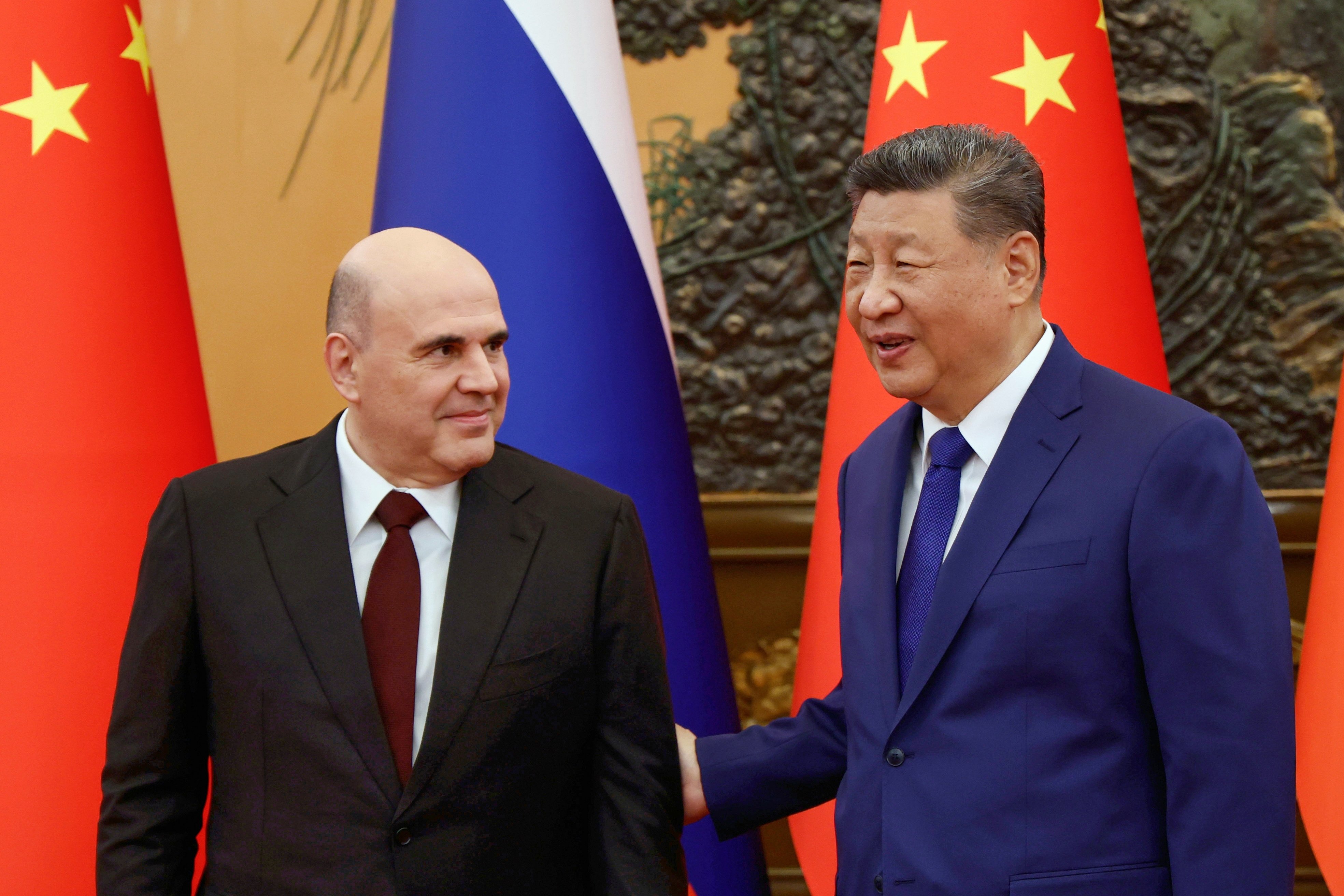 Chinese President Xi Jinping welcomes Russian Prime Minister Mikhail Mishustin for talks in Beijing on Tuesday. Photo: AP