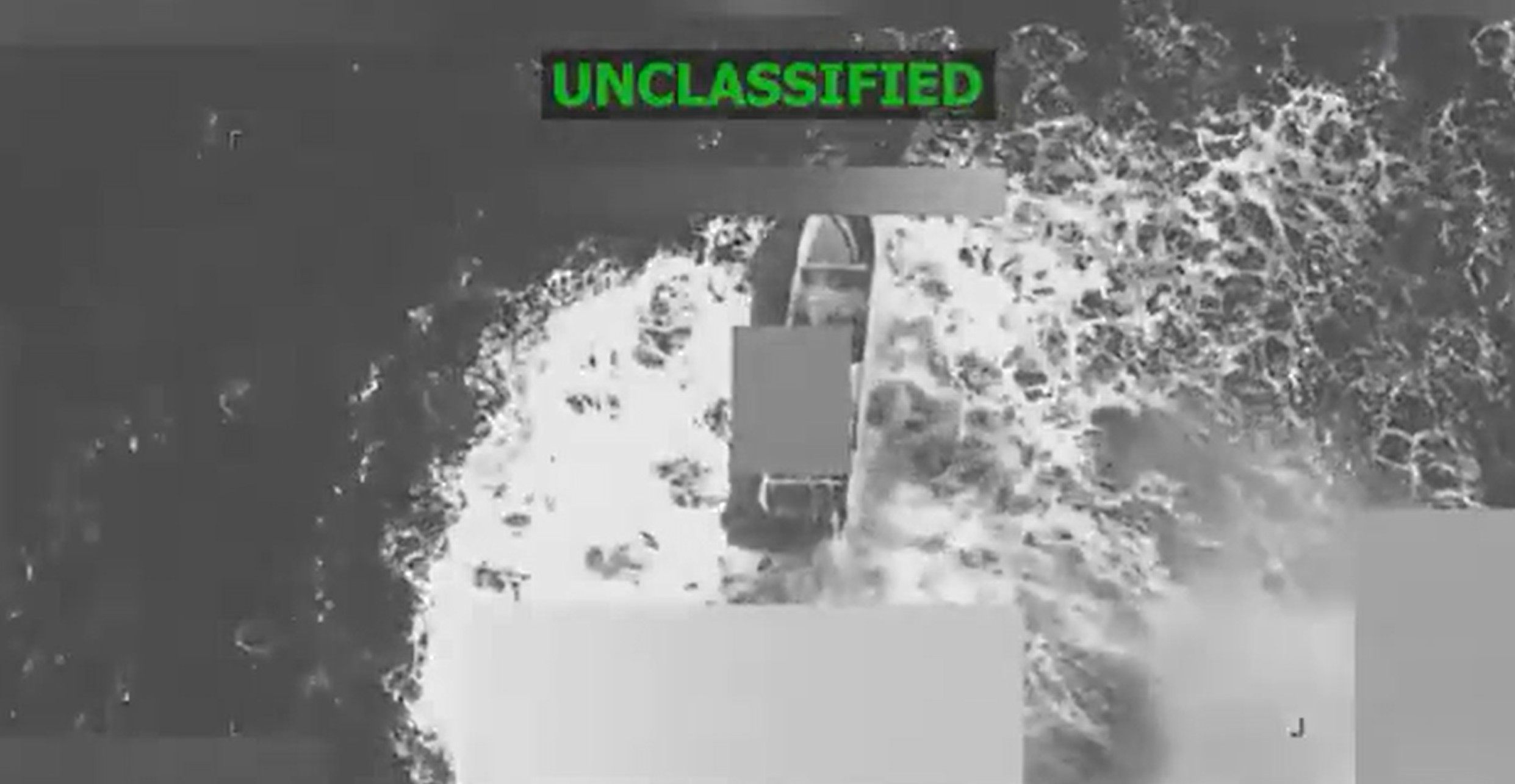 An image from a video US Defence Secretary Pete Hegseth posted to social media has a grey box obscuring a boat that appears in the water before it’s blown up. Photo: X @SecWar