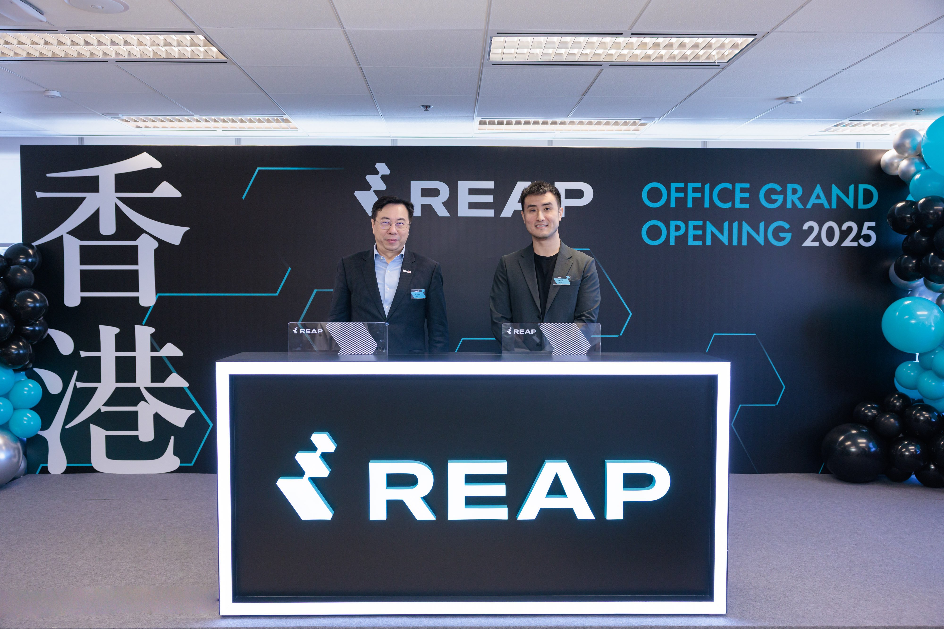 Kevin Kang, co-founder of Reap (right), and Arnold Lau, of InvestHK, attend the opening of the headquarters. Photo: Handout