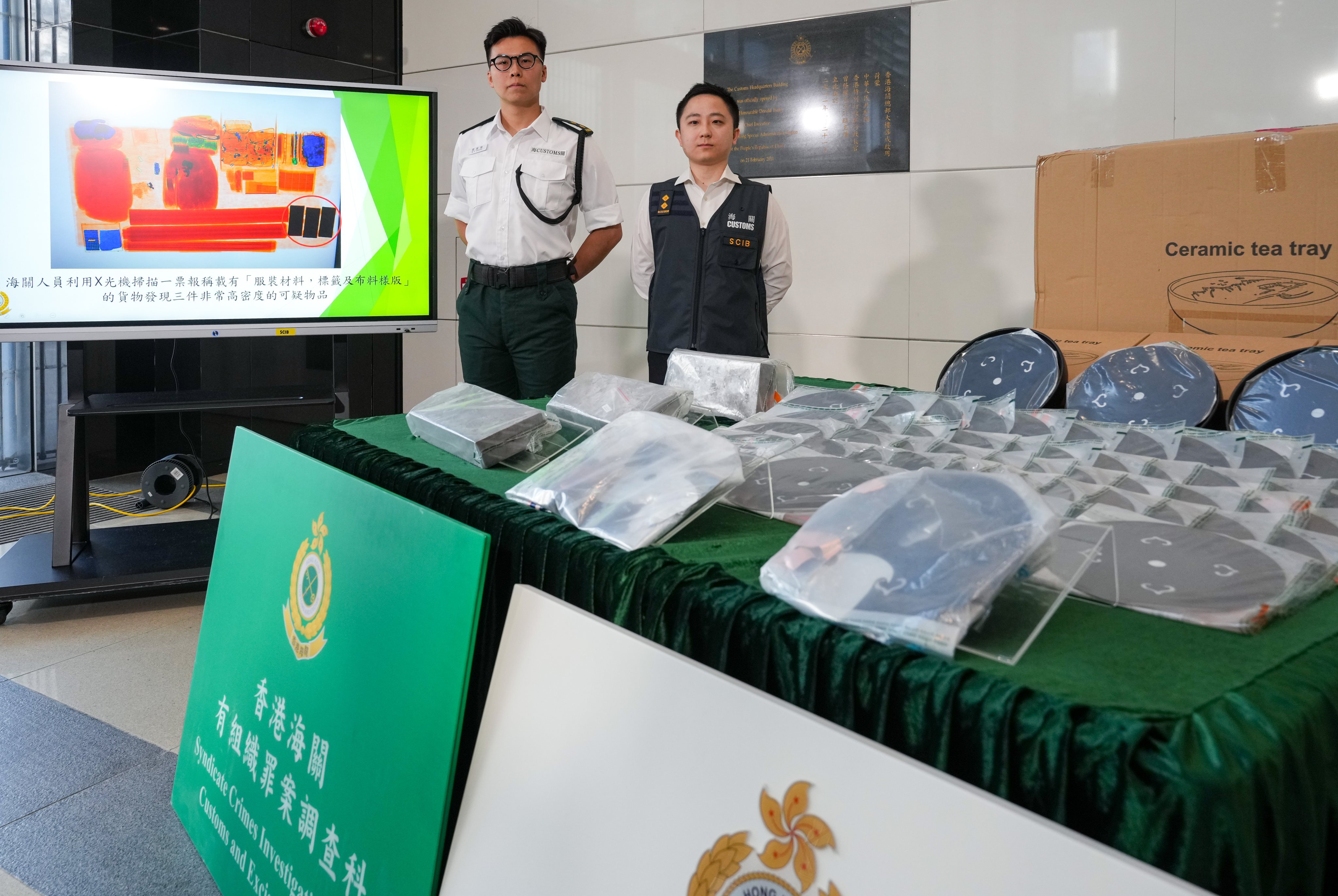 Customs officers showcase the confiscated precious metals at a press conference. Photo: Sam Tsang