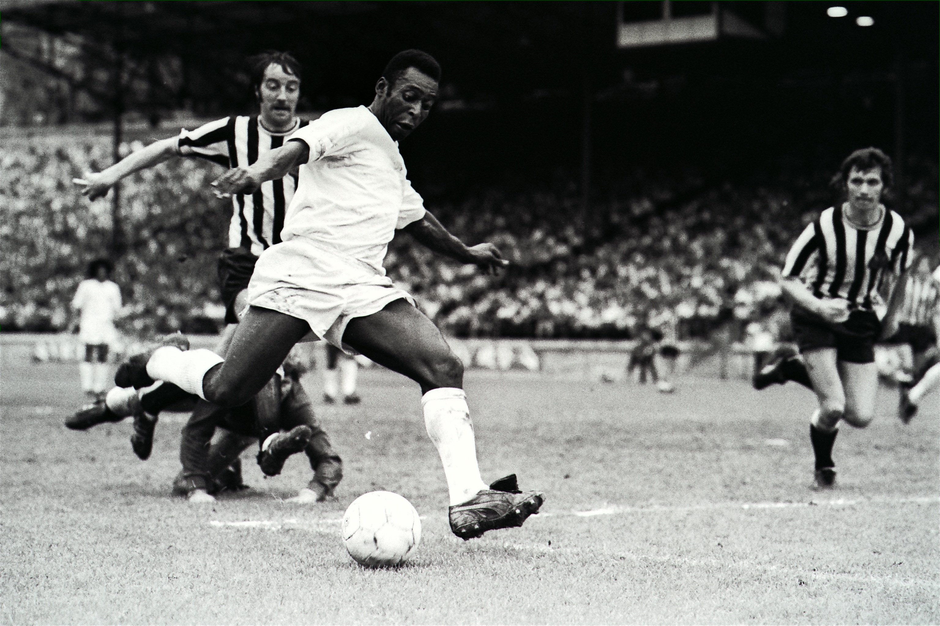 Football legend Pele in action for his team Santos in an exhibition game against British side Newcastle at the Hongkong Stadium in 1972. Photo: SCMP Archives