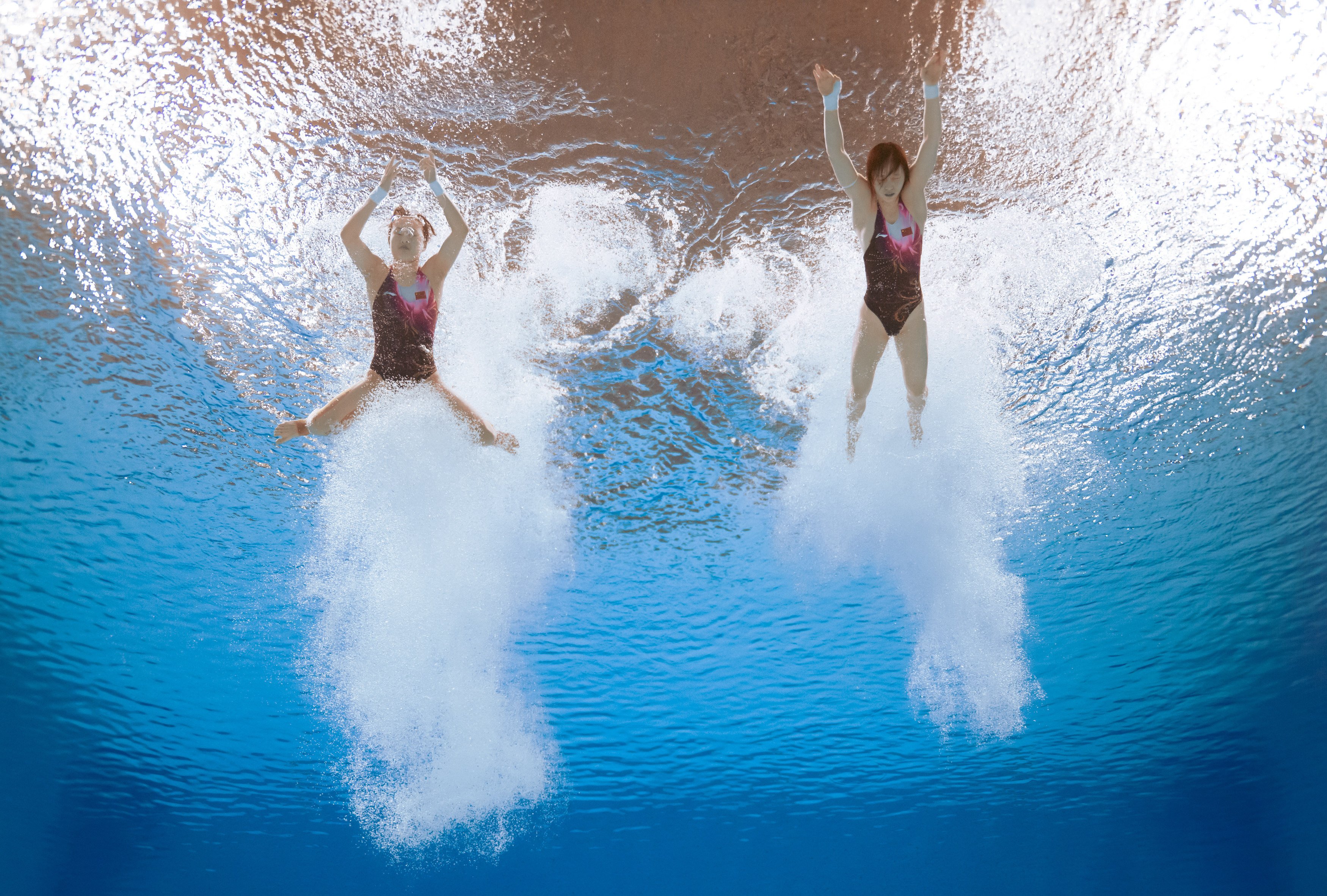 Shanghai’s Chen Yuxi and Zhang Minjie return to the surface after competing in the women’s synchronised 10-metre platform diving competition. Photo: Xinhua