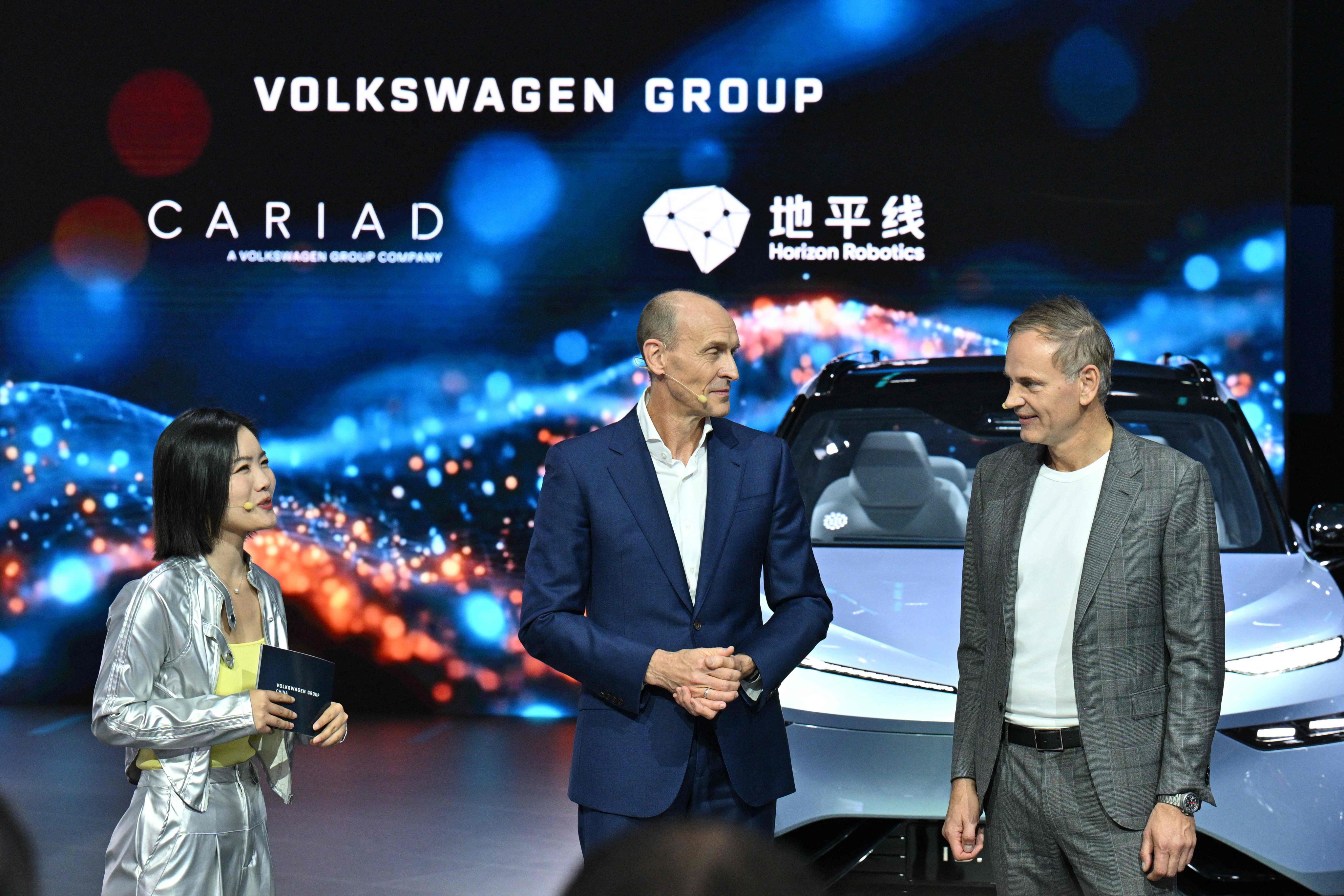 Chairman and CEO of Volkswagen Group China Ralf Brandstatter (centre) is seen at the China International Import Expo in Shanghai on Wednesday. A Volkswagen source said it will “take appropriate measures in response to further developments” amid the Nexperia semiconductor crisis that has roiled the auto chip supply chain. Photo: AFP