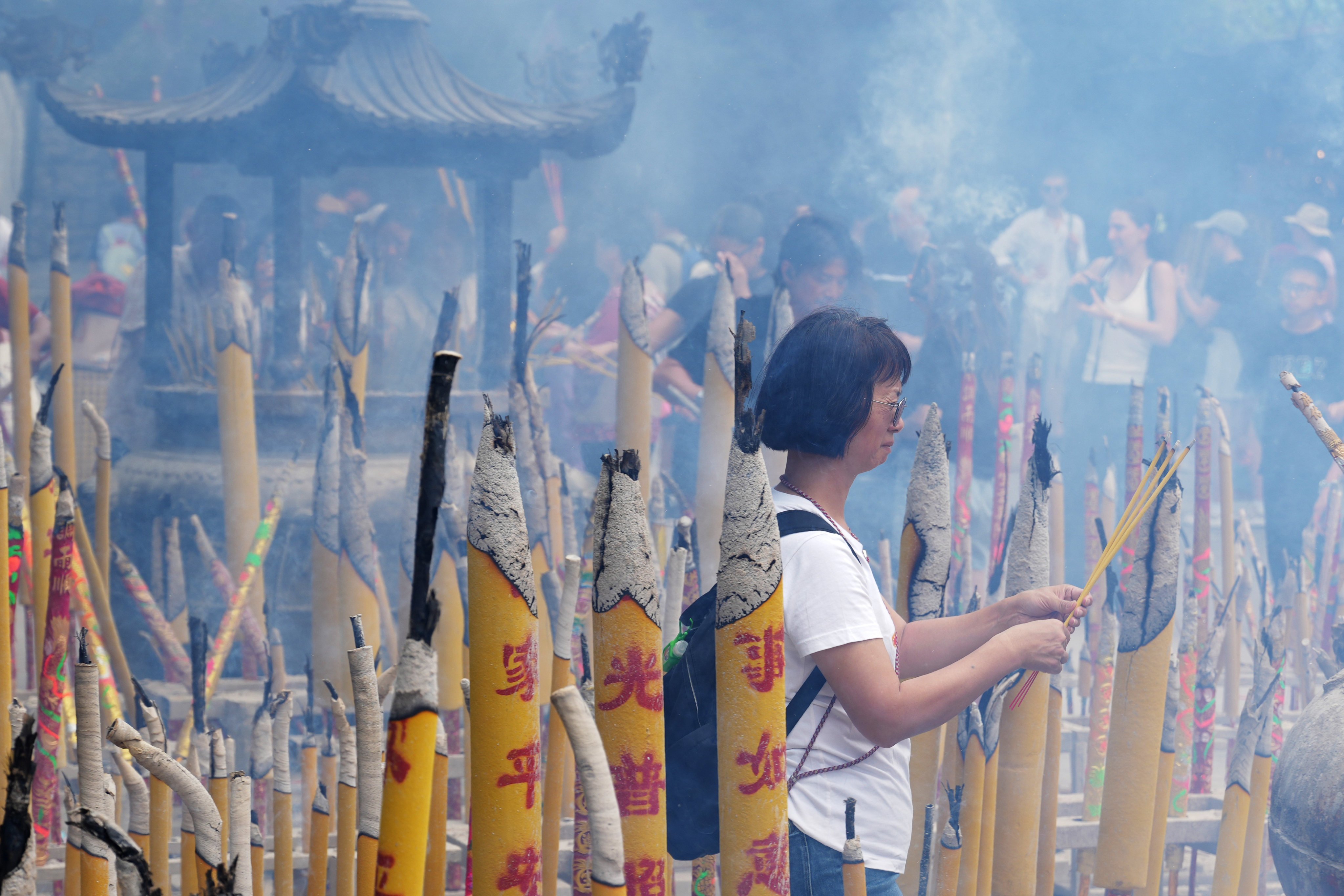 Joss sticks are burned at a Buddha Bathing Ceremony to commemorate the birth of the Buddha at the Po Lin Monastery in Lantau, Hong Kong, on May 5. Photo: May Tse