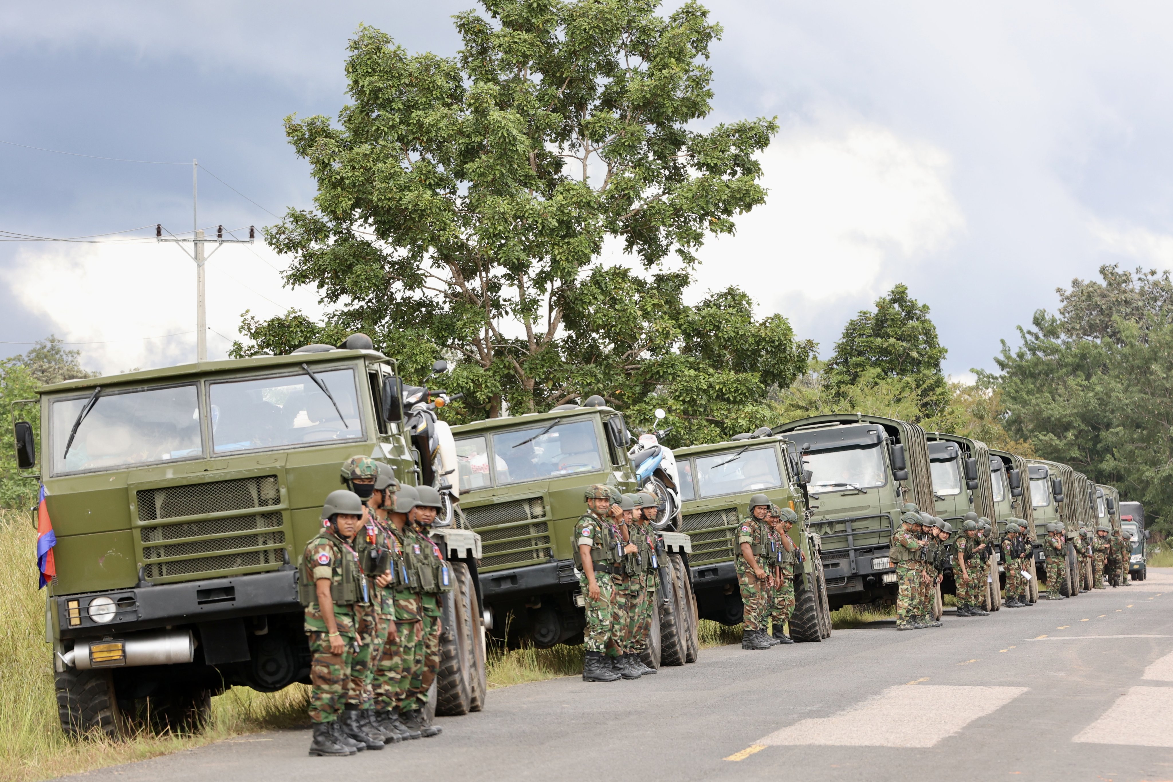 Cambodian military vehicles prepare to withdraw from border areas in Preah Vihear province on Saturday after the country signed a peace deal with Thailand. Photo: EPA/AKP