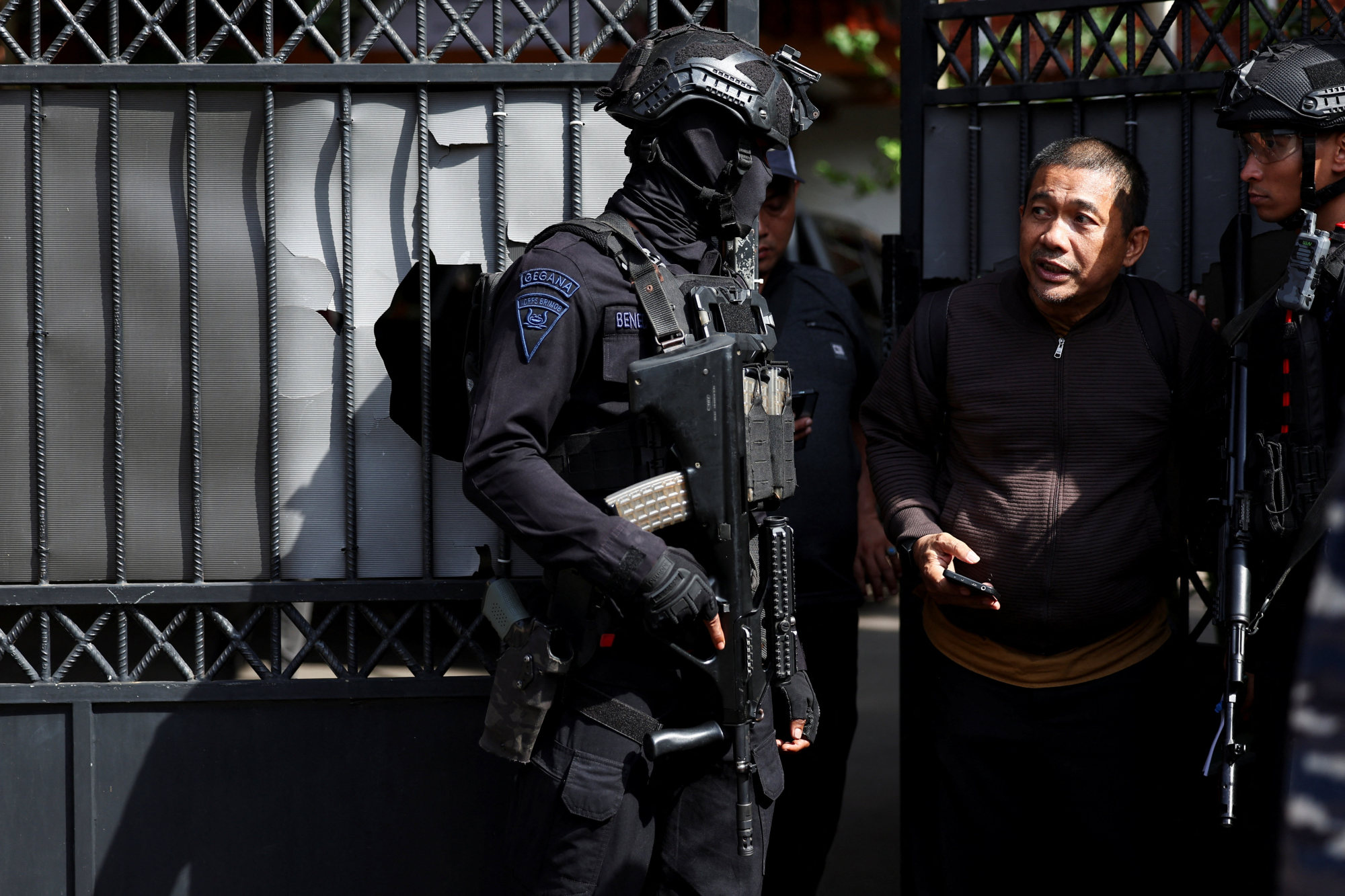 Armed police personnel stand guard outside an area after an explosion occurred at a school complex in Jakarta on Friday. Photo: Reuters Armed police personnel stand guard outside an area after an explosion occurred at a school complex in Jakarta on Friday. Photo: Reuters