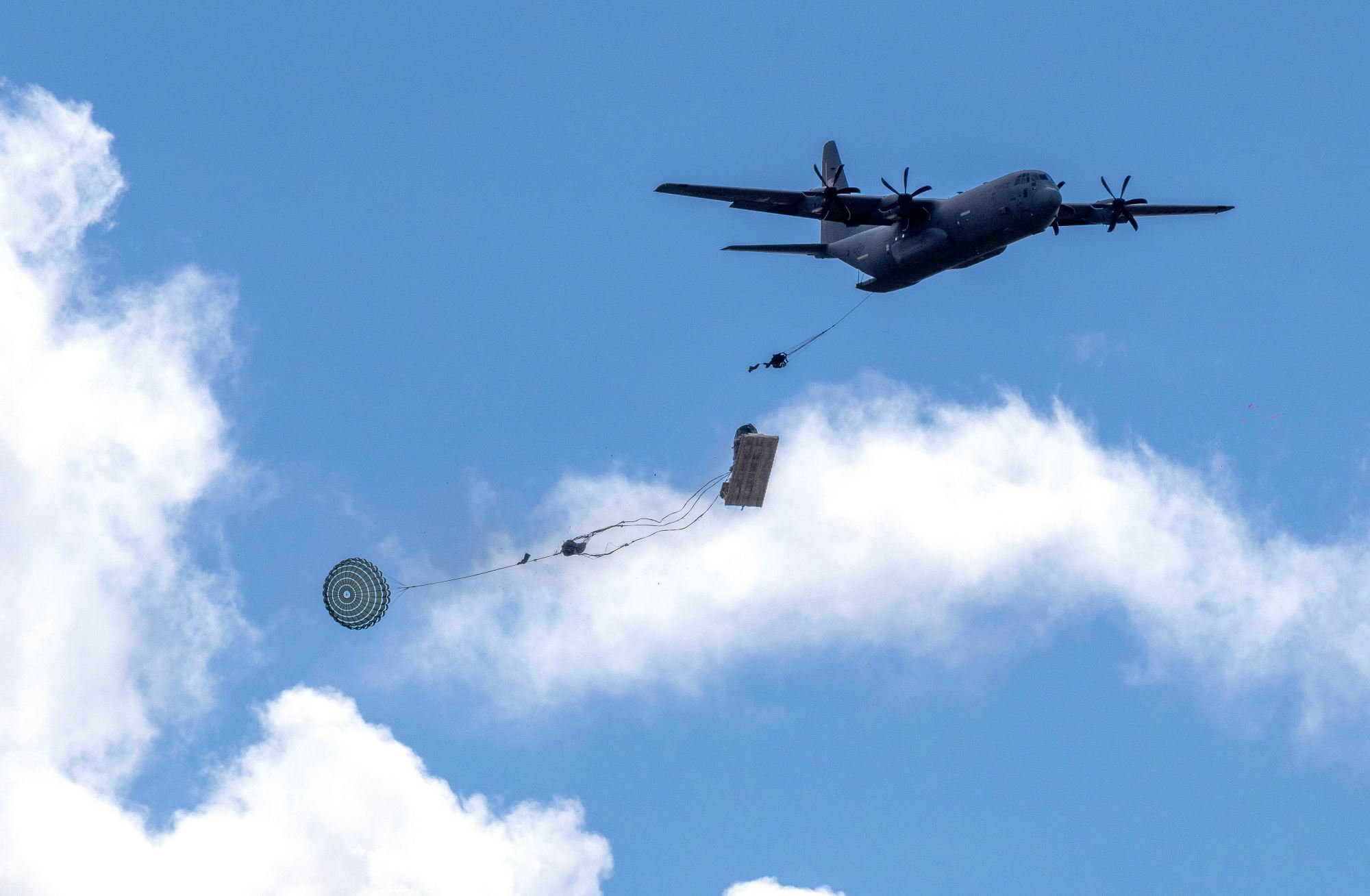 A US Army C-130 aircraft drops military equipment during joint drills in Lithuania earlier this year. Photo: AP A US Army C-130 aircraft drops military equipment during joint drills in Lithuania earlier this year. Photo: AP