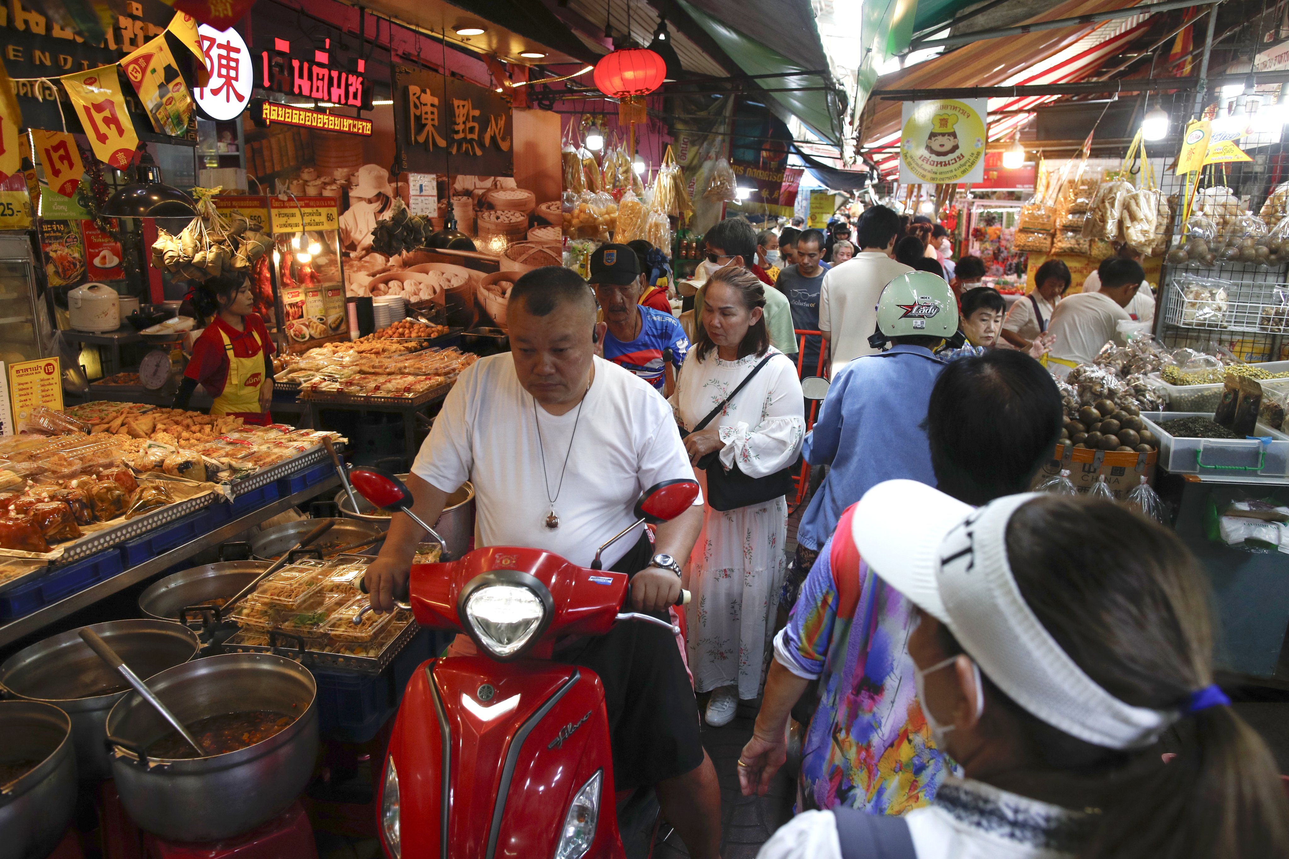 Customers flock to buy vegetarian food during the Vegetarian Festival at a market in Chinatown in Bangkok on October 21. The International Monetary Fund has projected Thailand’s economic growth forecast for 2025 at 2 per cent and expects the gross domestic product to sharply slow to 1.6 per cent for 2026. Photo: EPA