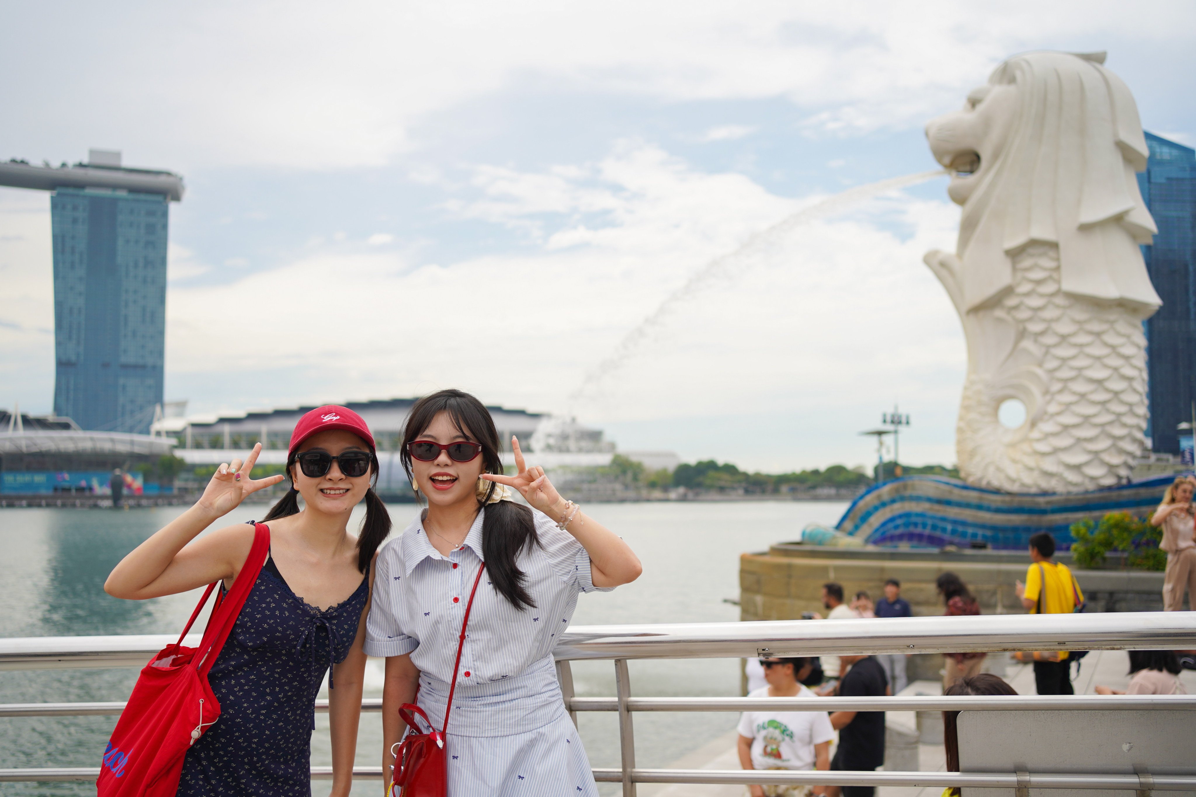 Chinese tourists Alice and Vivian Zhou opted for sightseeing instead of shopping to stick to their travel budget while visiting Singapore. Photo: Kolette Lim