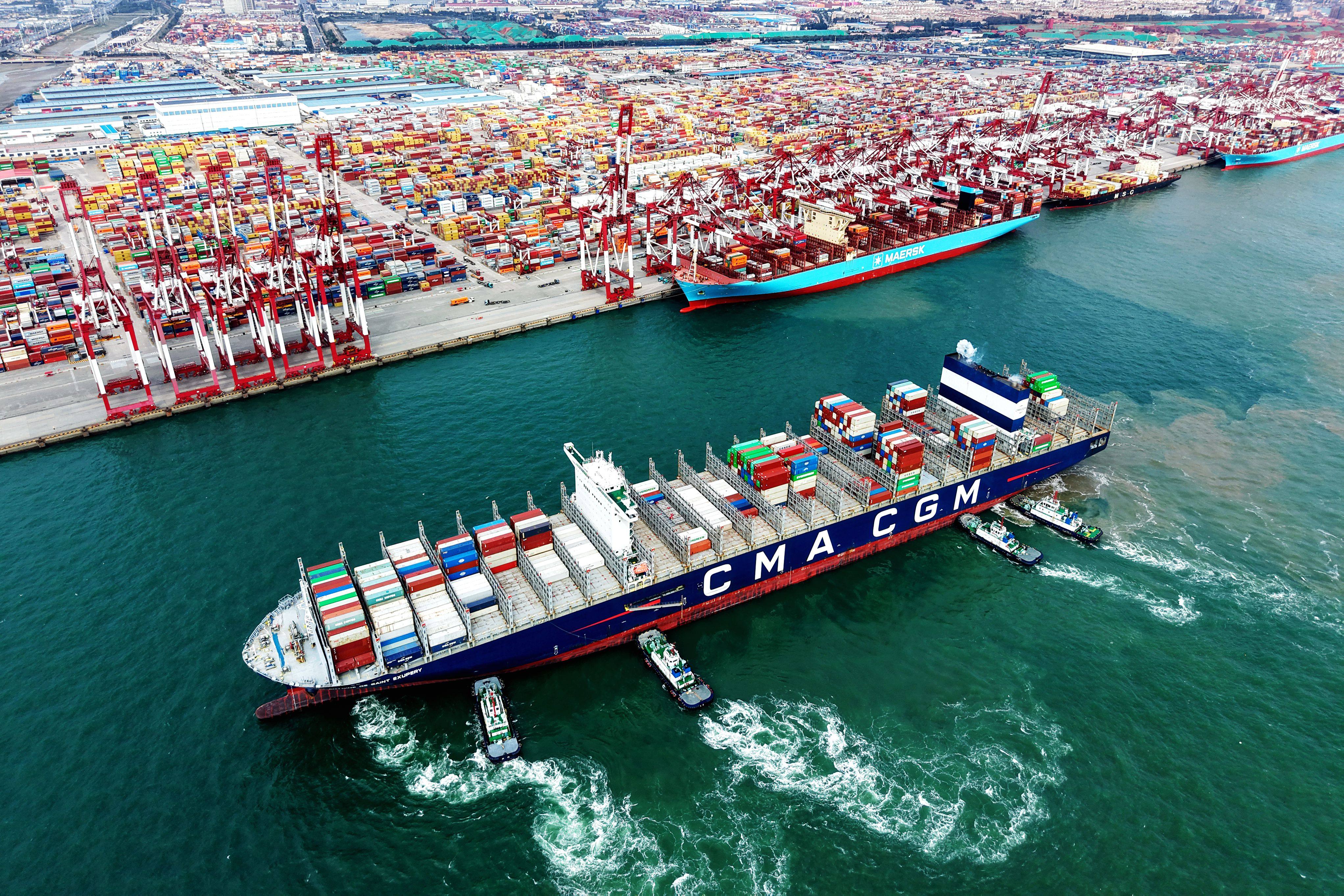 An aerial drone photo shows a cargo ship, assisted by tugboats, berthing at a container terminal of Qingdao Port in east China’s Shandong province on October 20. Photo: Xinhua