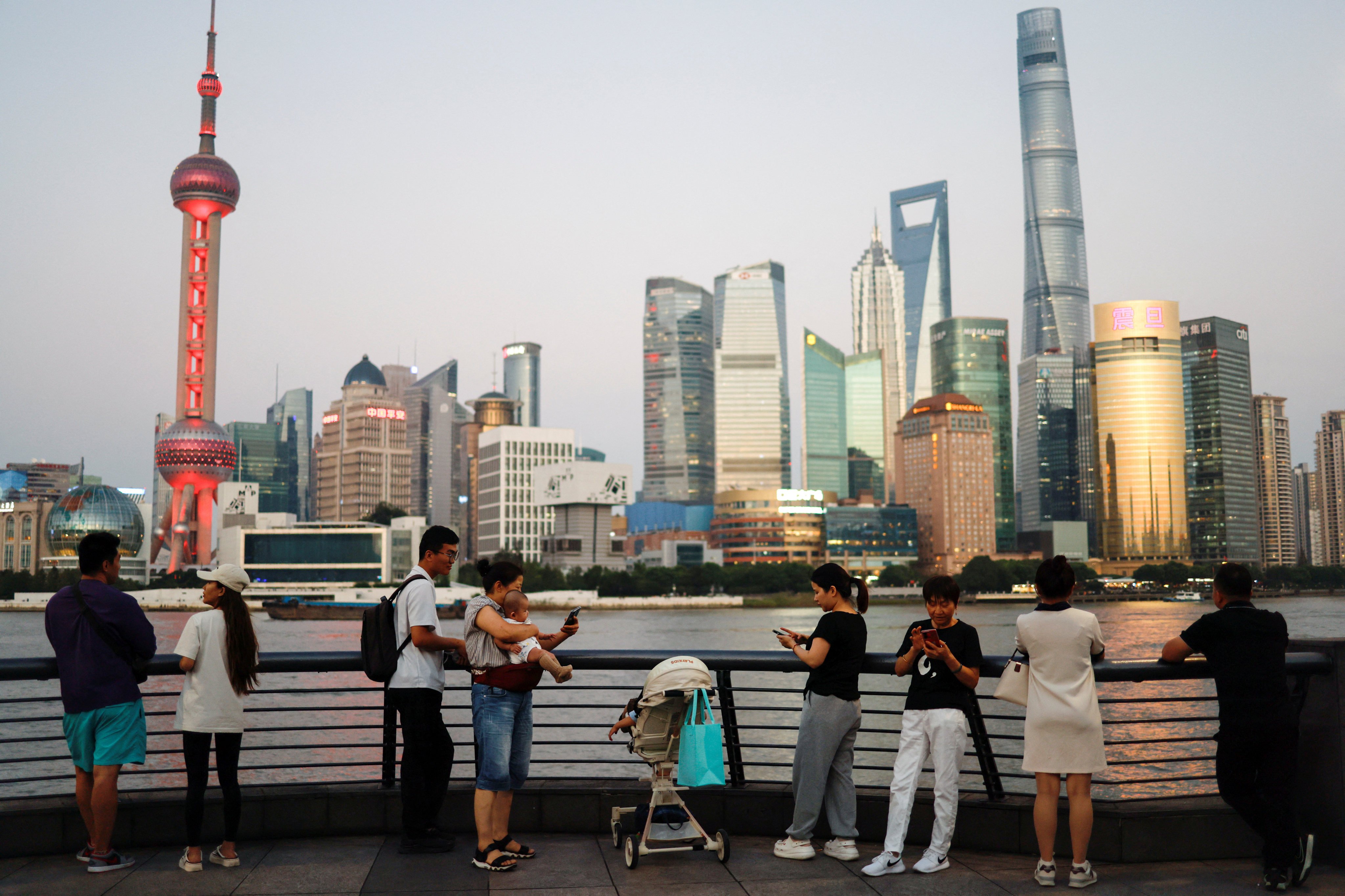 People enjoy themself on the Bund near the financial district of Pudong, in Shanghai, China, on September 27, 2024. Photo: Reuters