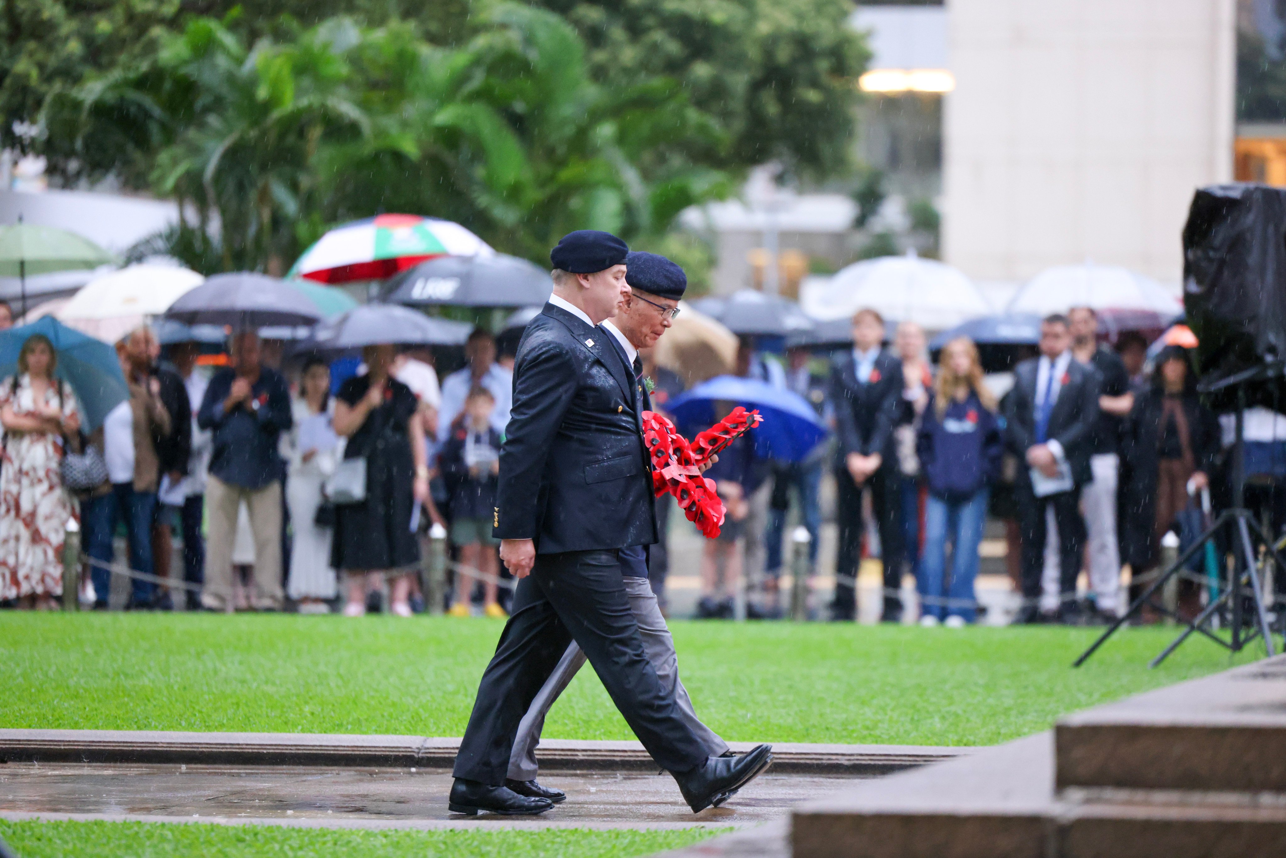 Representatives present poppy wreaths during the Anzac Day Dawn Service held at The Cenotaph in Central, Hong Kong, on 25 April. Photo: Nora Tam
