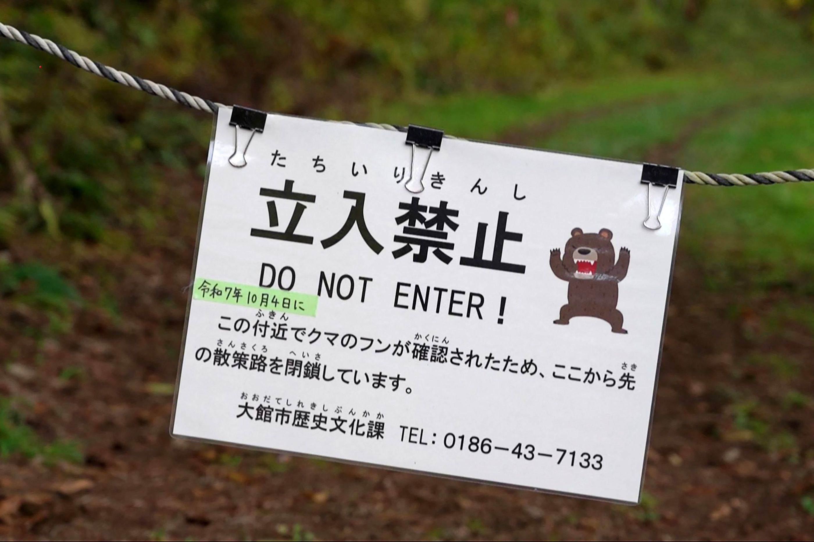 A sign warns visitors about bears in a forested area in Japan’s Akita prefecture on October 25. Photo: AFP