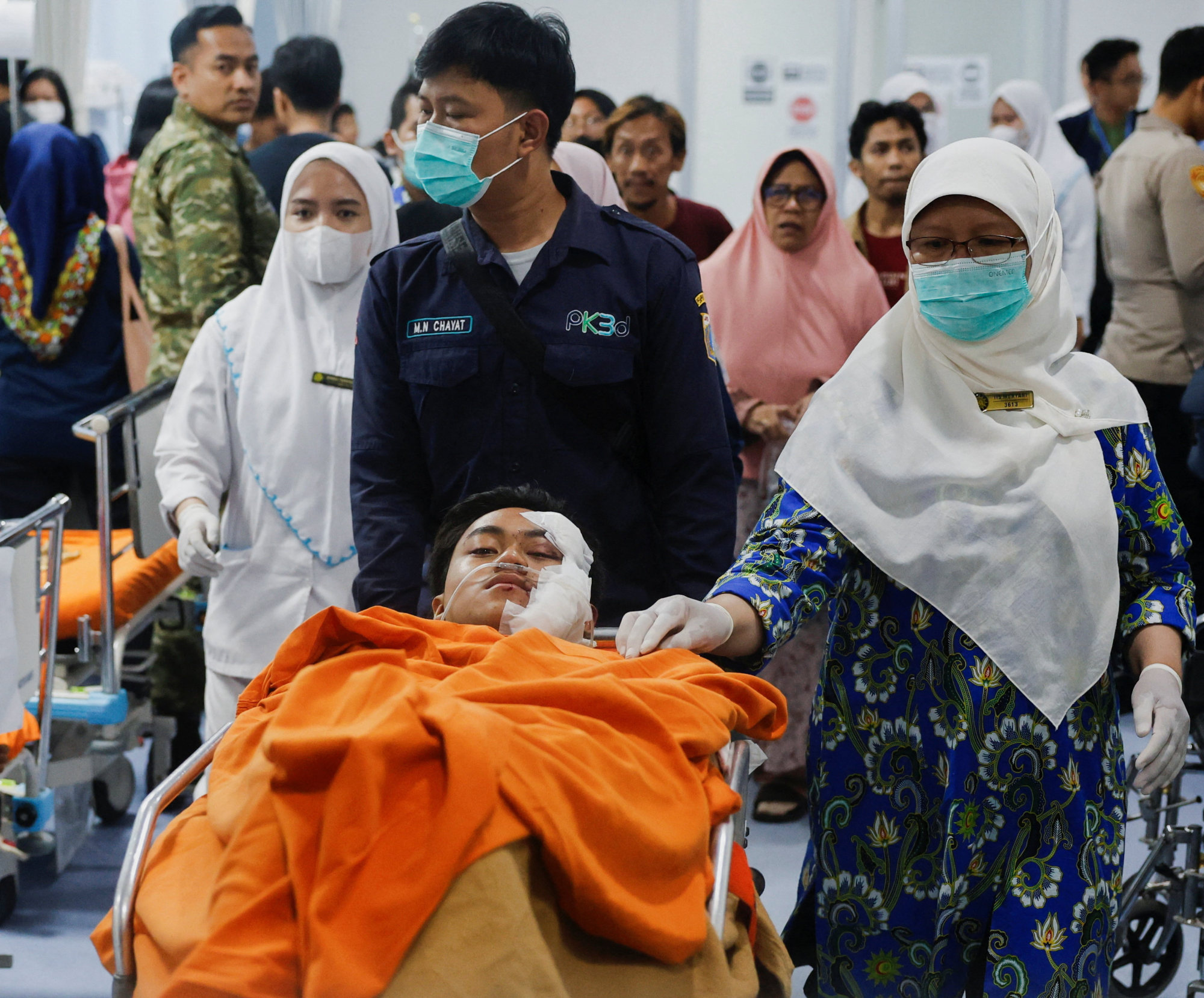 Medical workers push a student injured in Friday’s blast on a stretcher at the Jakarta Islamic Hospital. Photo: Reuters Medical workers push a student injured in Friday’s blast on a stretcher at the Jakarta Islamic Hospital. Photo: Reuters