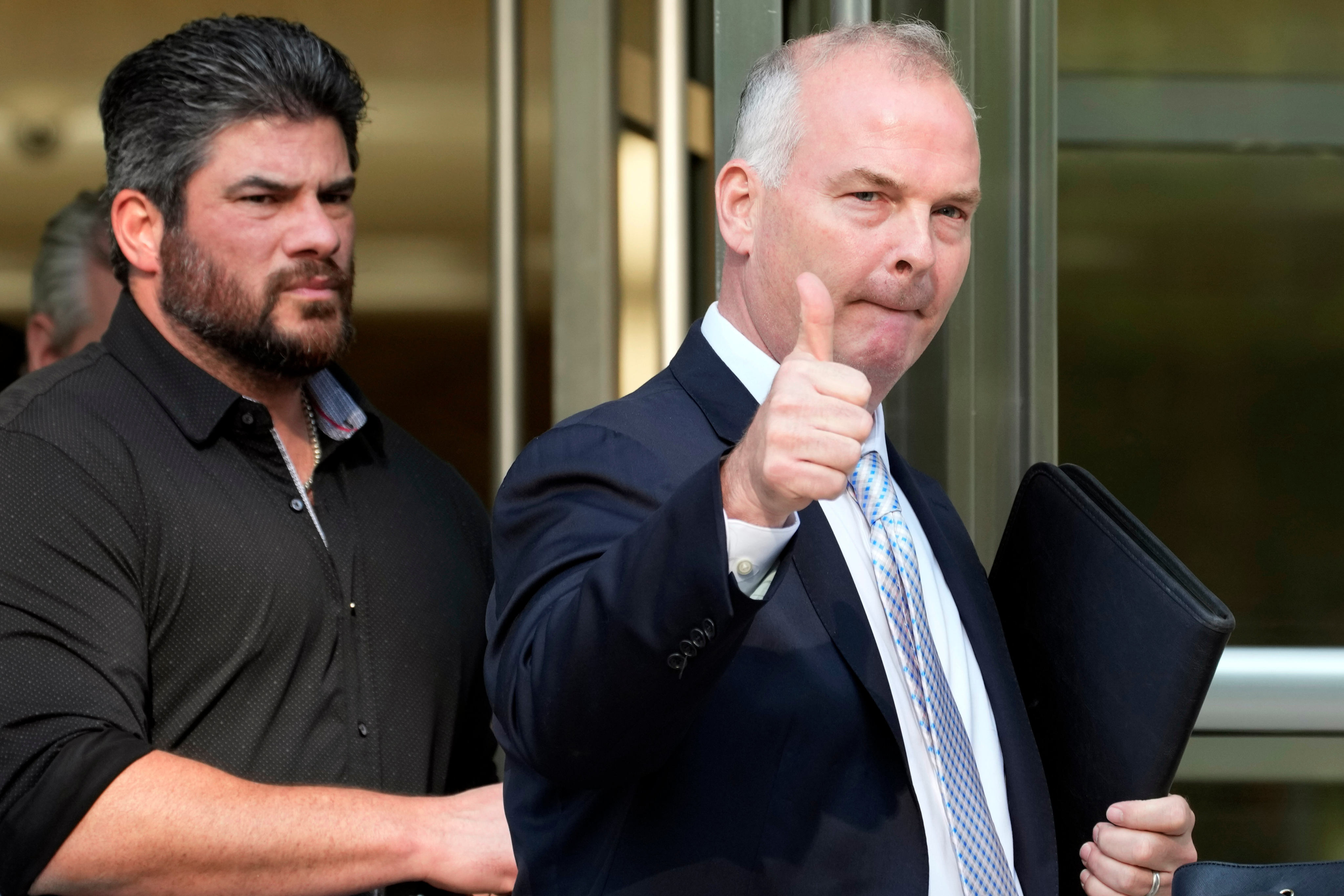 Michael McMahon gives photographers a thumbs up as he leaves federal court in New York in May 2023. Photo: AP