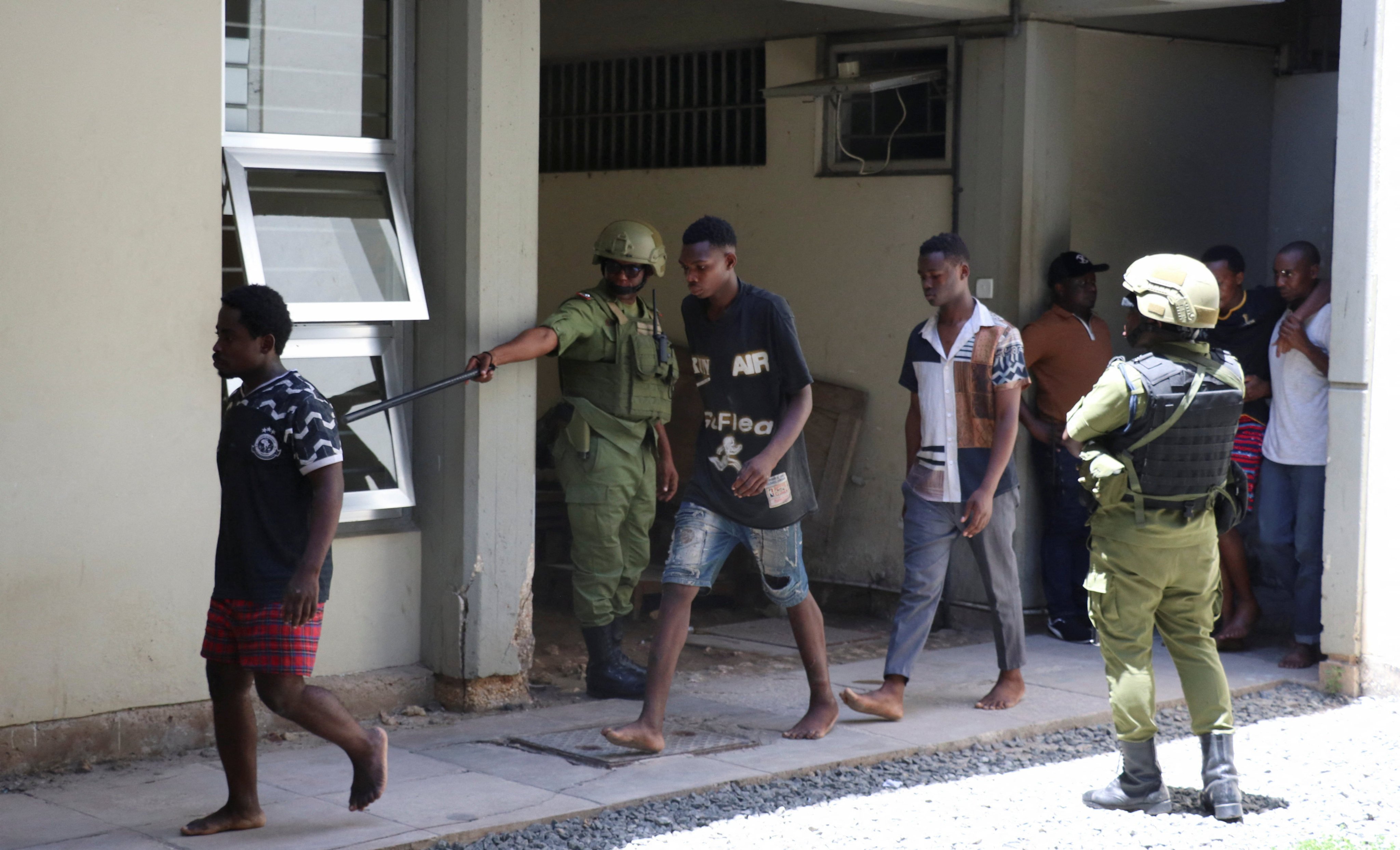 Tanzanians charged with treason for alleged involvement in last week’s violent protests arrive at the Kisutu Resident Magistrate’s Court in Dar es Salaam on Friday. Photo: Reuters