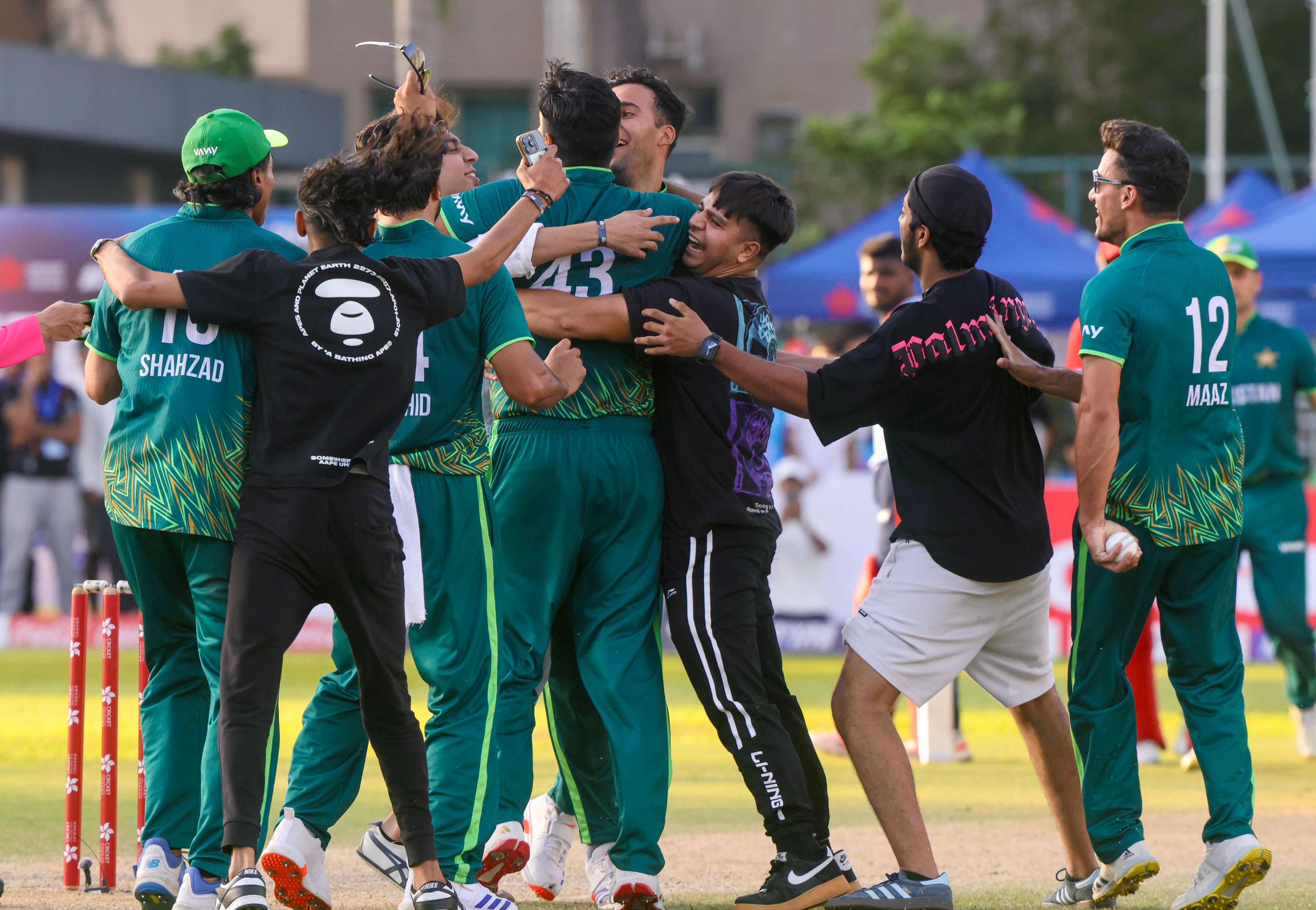 Pakistan celebrate with ecstatic fans after beating Kuwait to win the Hong Kong Cricket Sixes. Photo: Jonathan Wong