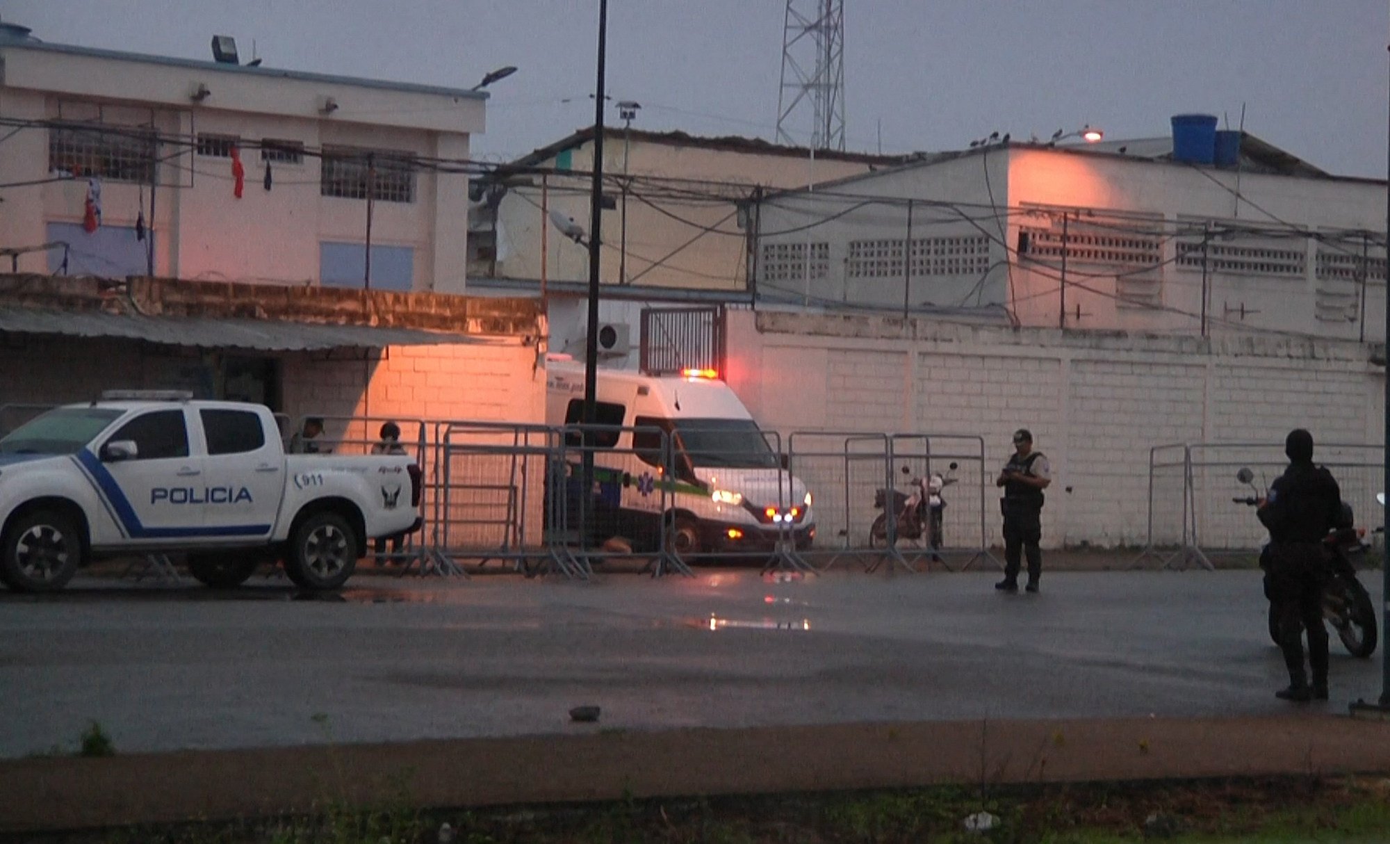 An ambulance at the entrance of the prison in Machala, Ecuador. Photo: AFP