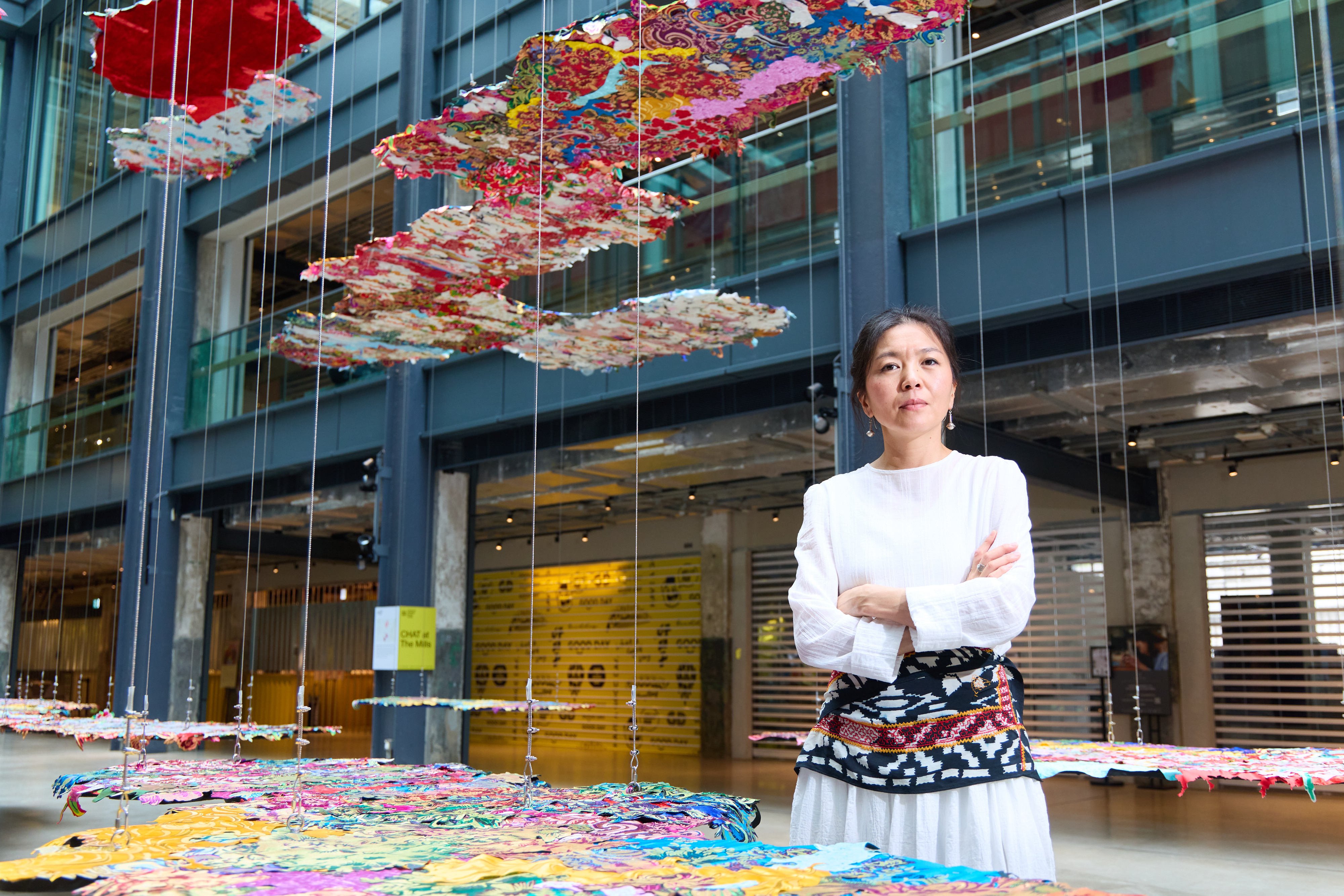 Kazakh artist Gulnur Mukazhanova stands beside her installation False Hope or Moment of the Present, at the Mills in Tsuen Wan, Hong Kong. The piece, on show until November 30, kicks off her exhibition Dowry of the Soul, which runs from November 14 to March 1, 2026. Photo: Chat