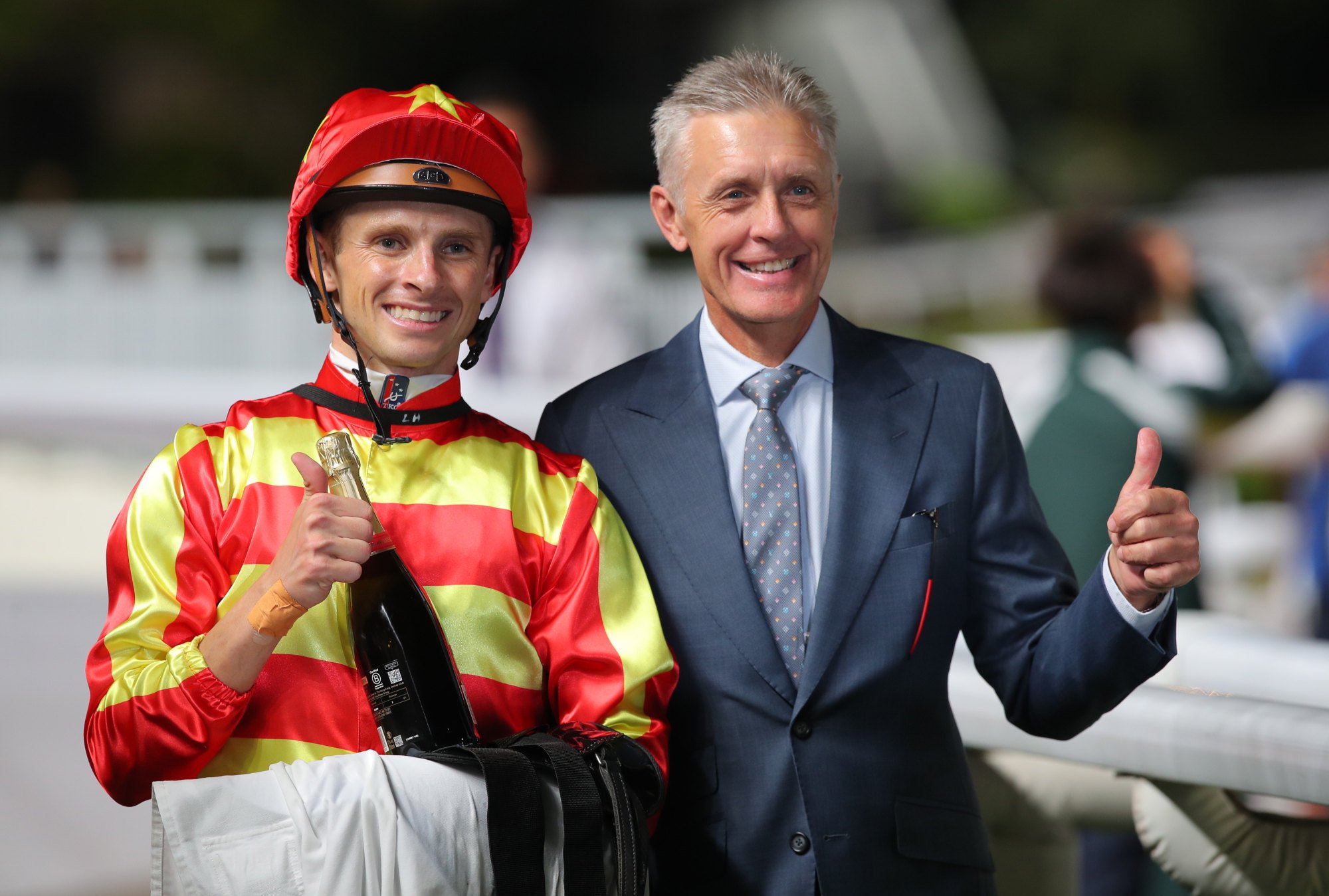 Mark Newnham celebrates his most recent winner with Lyle Hewitson at Sha Tin. Mark Newnham celebrates his most recent winner with Lyle Hewitson at Sha Tin.