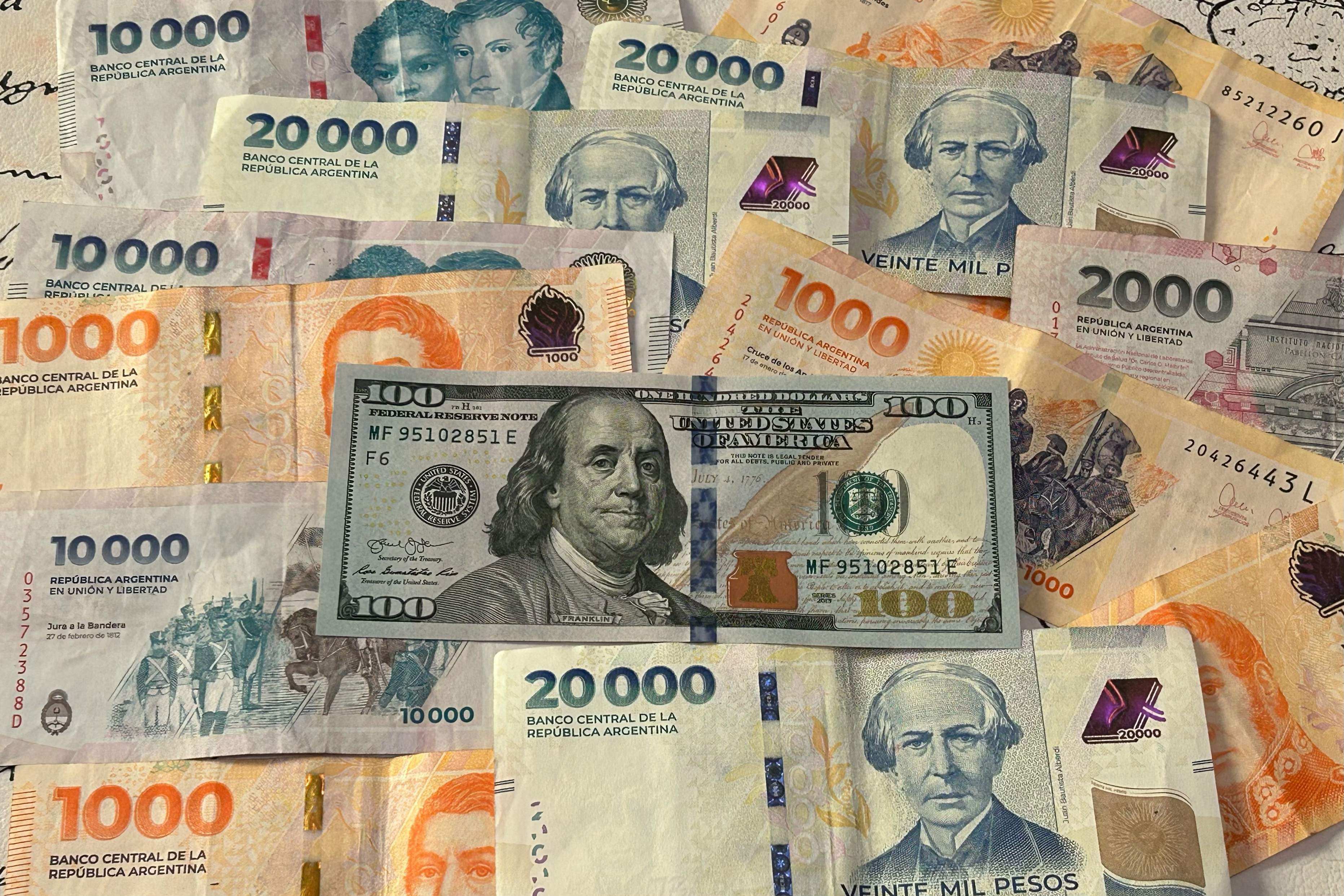 A photo collage of global currencies with the US dollar in the centre. Photo: Agence-France Presse