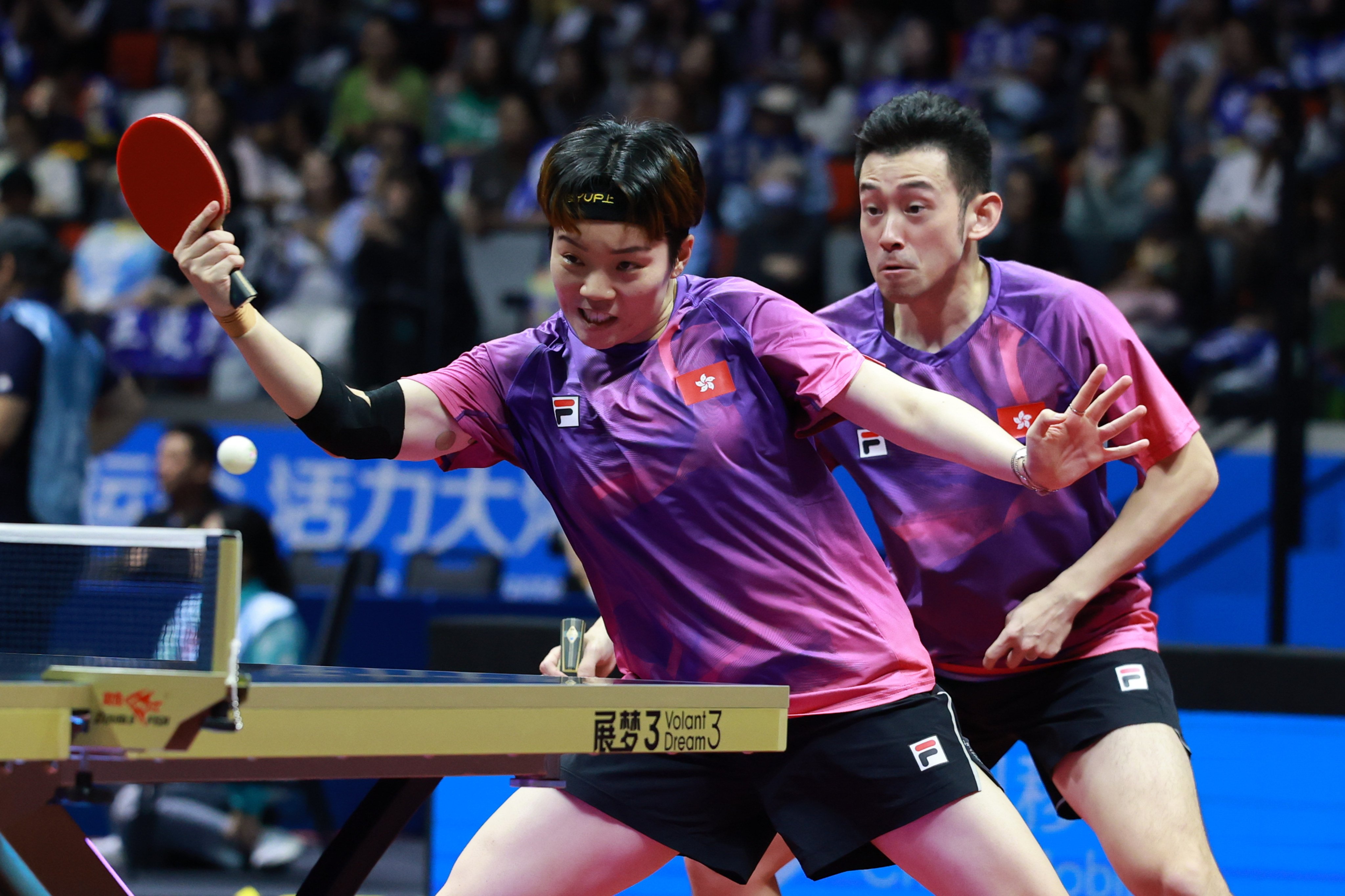 Hong Kong’s Wong Chun-ting (right) and Doo Hoi-kem in action during their mixed doubles quarter-final in Macau. Photo: Xinhua