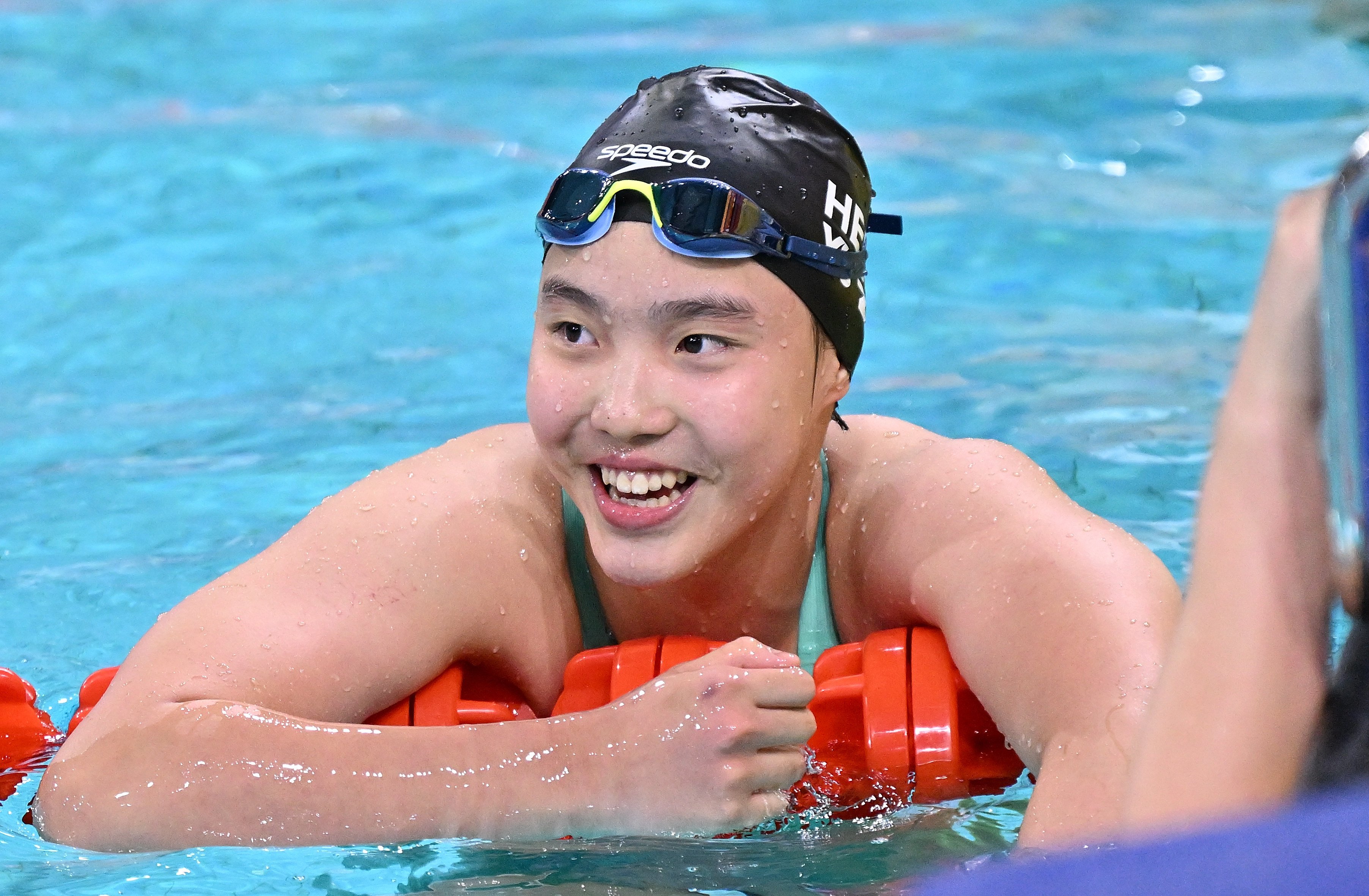 Yu Zidi is all smiles after her record-breaking swim in Shenzhen. Photo: Xinhua