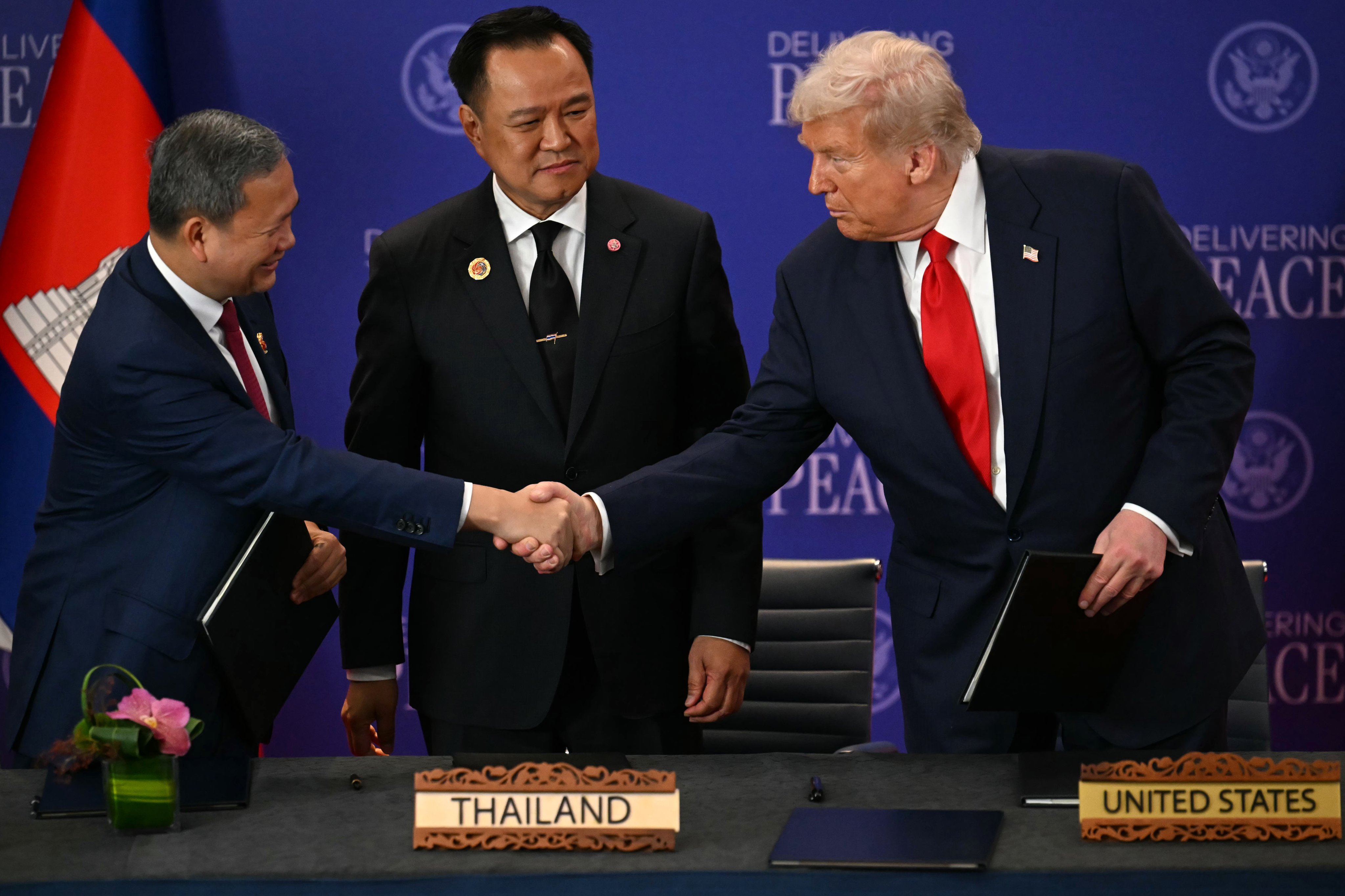 Thailand’s Prime Minister Anutin Charnvirakul (centre) looks on as Cambodian Prime Minister Hun Manet (left) shakes hands with US President Donald Trump on the sidelines of the Asean summit in Kuala Lumpur, Malaysia, on October 26. Photo: EPA