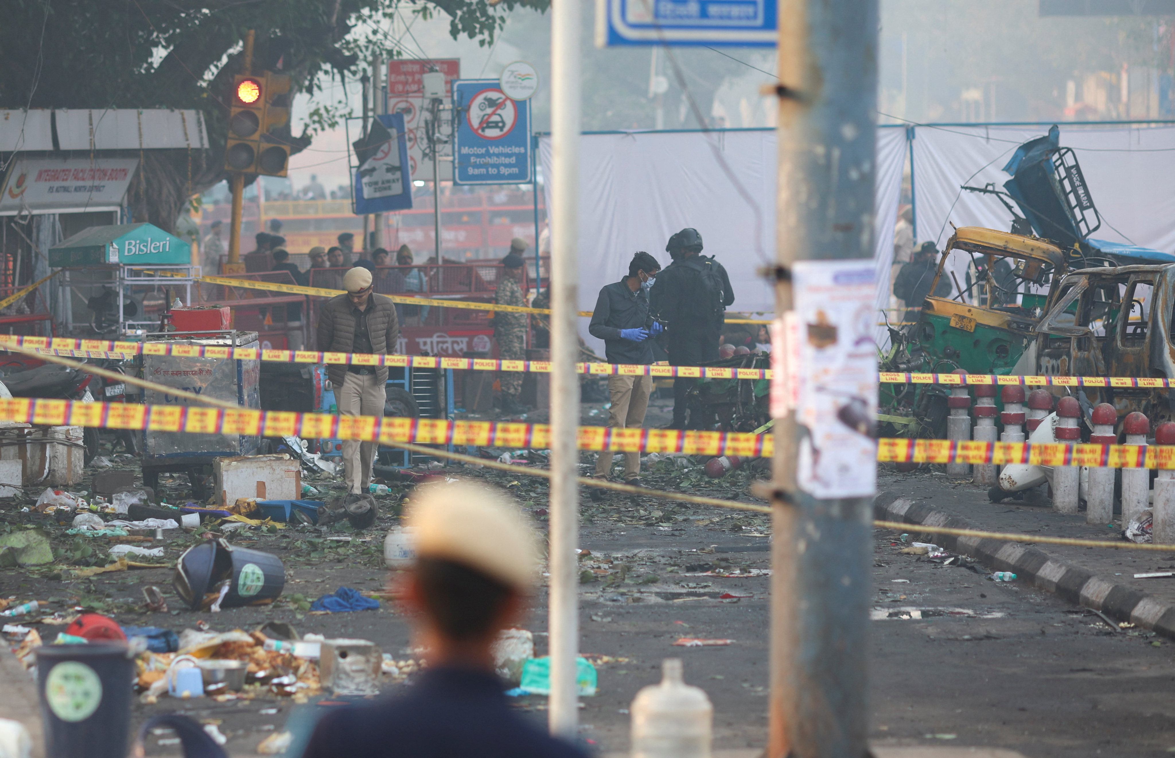Security personnel and members of a police forensic team work on Tuesday at the site of an explosion near the historic Red Fort in New Delhi. Photo: Reuters