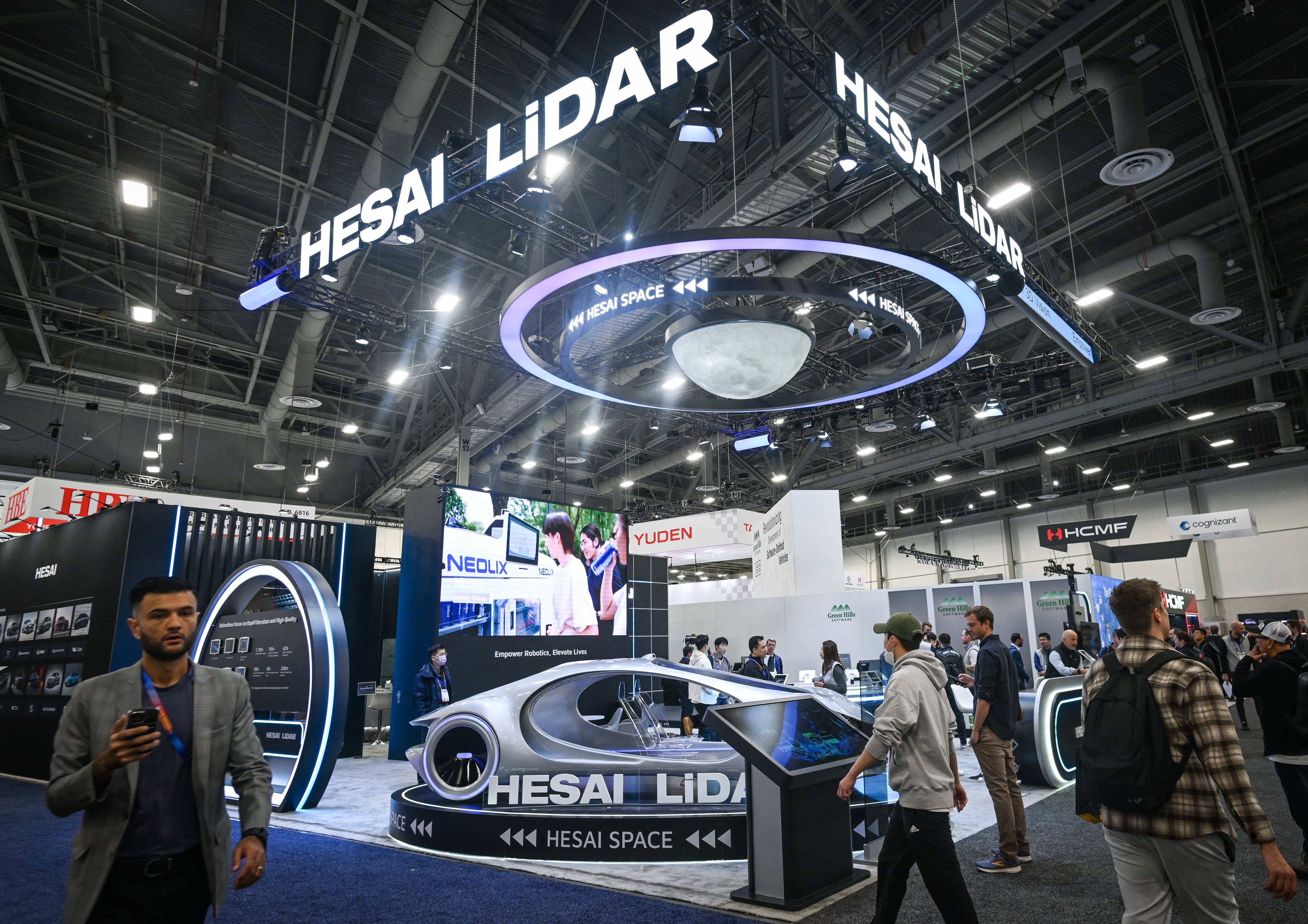 People pass the Hesai Group booth at CES 2025 in Las Vegas, Nevada, on January 9, 2025. Photo: NurPhoto via Getty Images