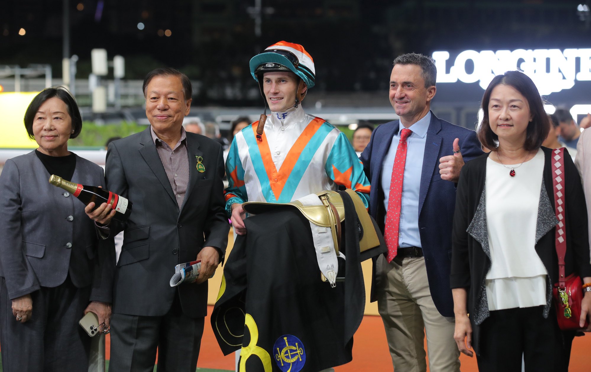 Jockey Luke Ferraris, trainer Douglas Whyte (second from right) and connections of King Oberon celebrate.
