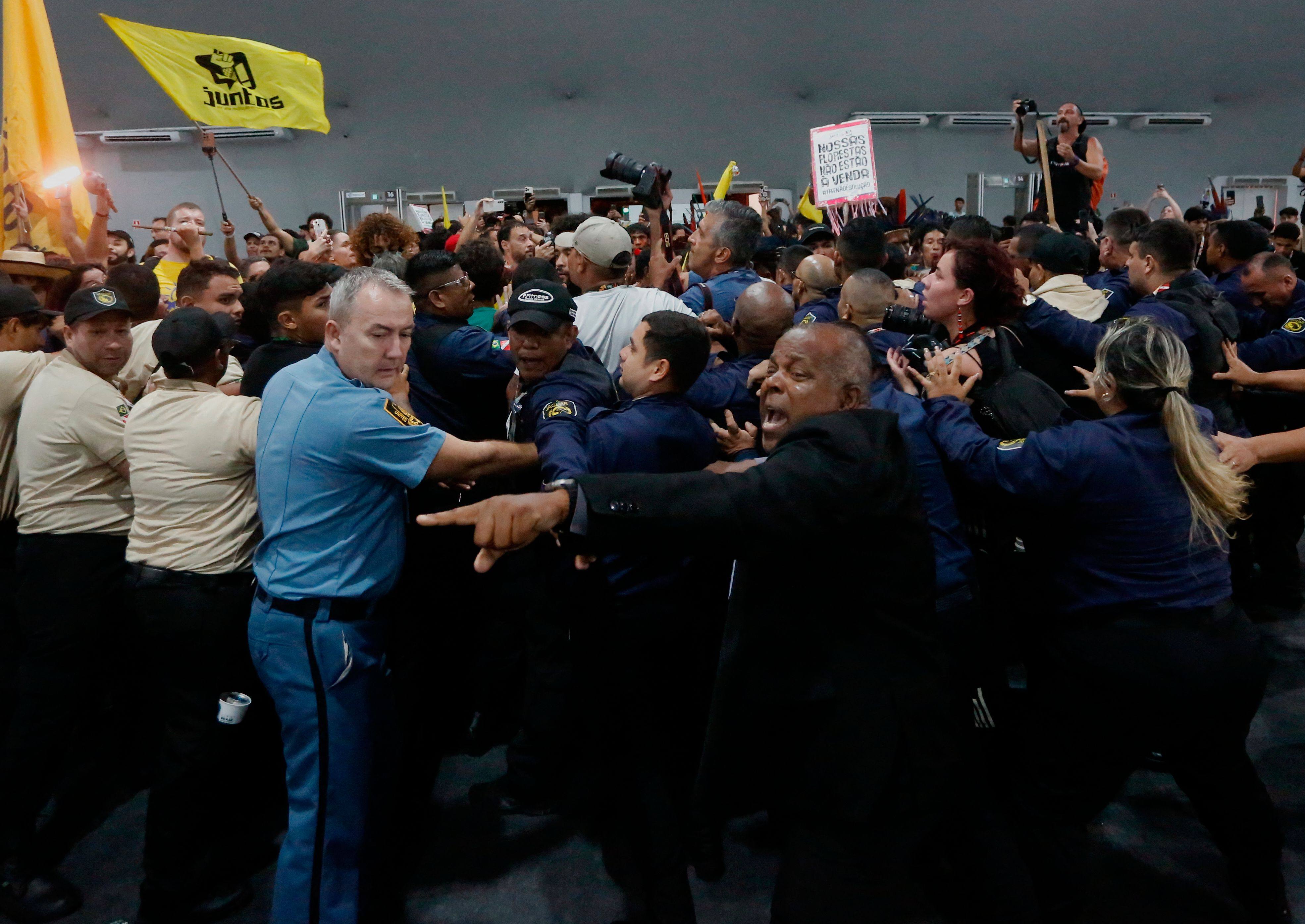 Security personnel clash with indigenous people and students as they storm the venue during the Cop30 UN Climate Change Conference in Belem, Para State, Brazil, on November 11. The clash underscored frustration among indigenous groups who demand forest protection. Photo: AFP