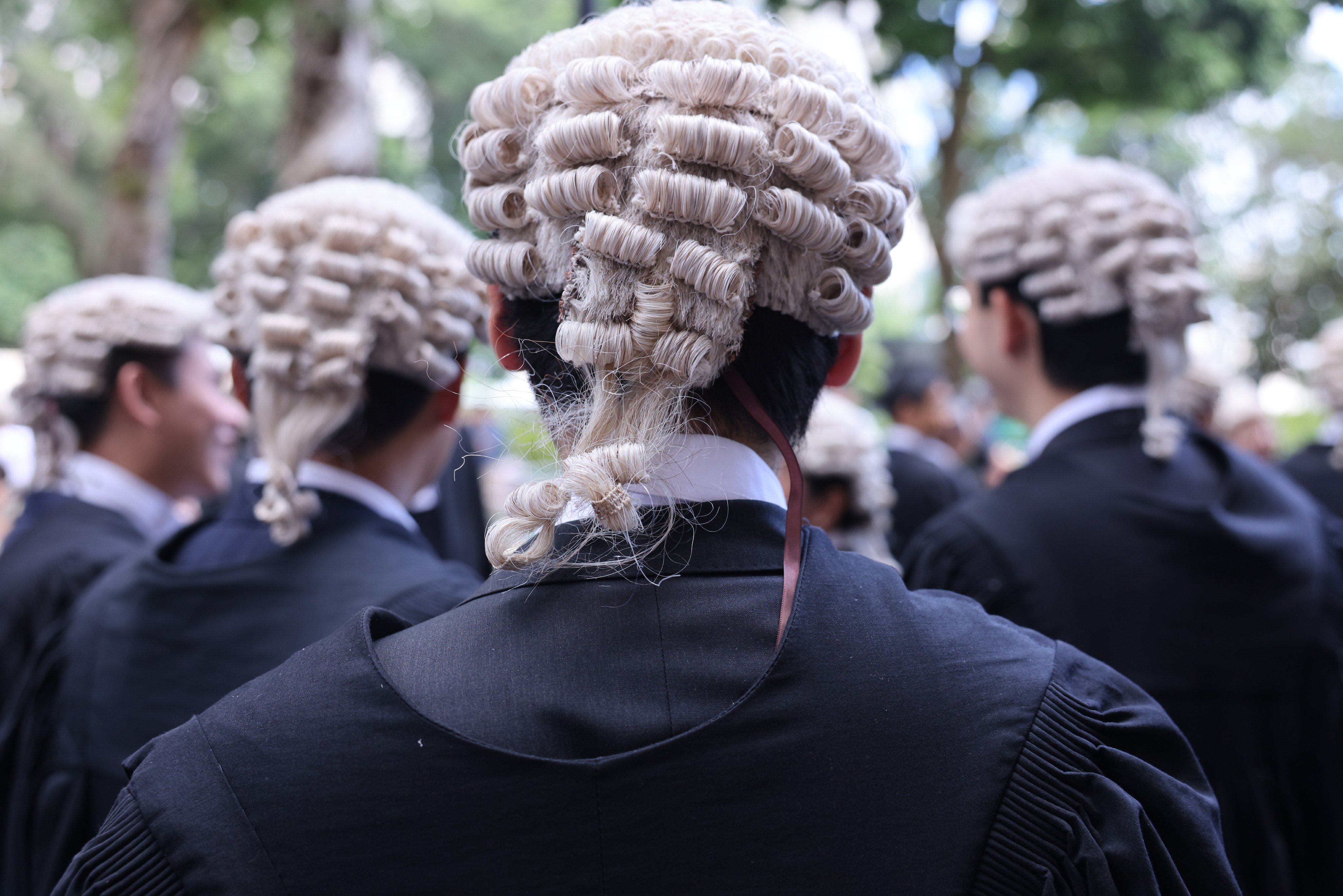 Wigs are part of a formal court uniform representing solemnity and tradition. Photo: Nora Tam