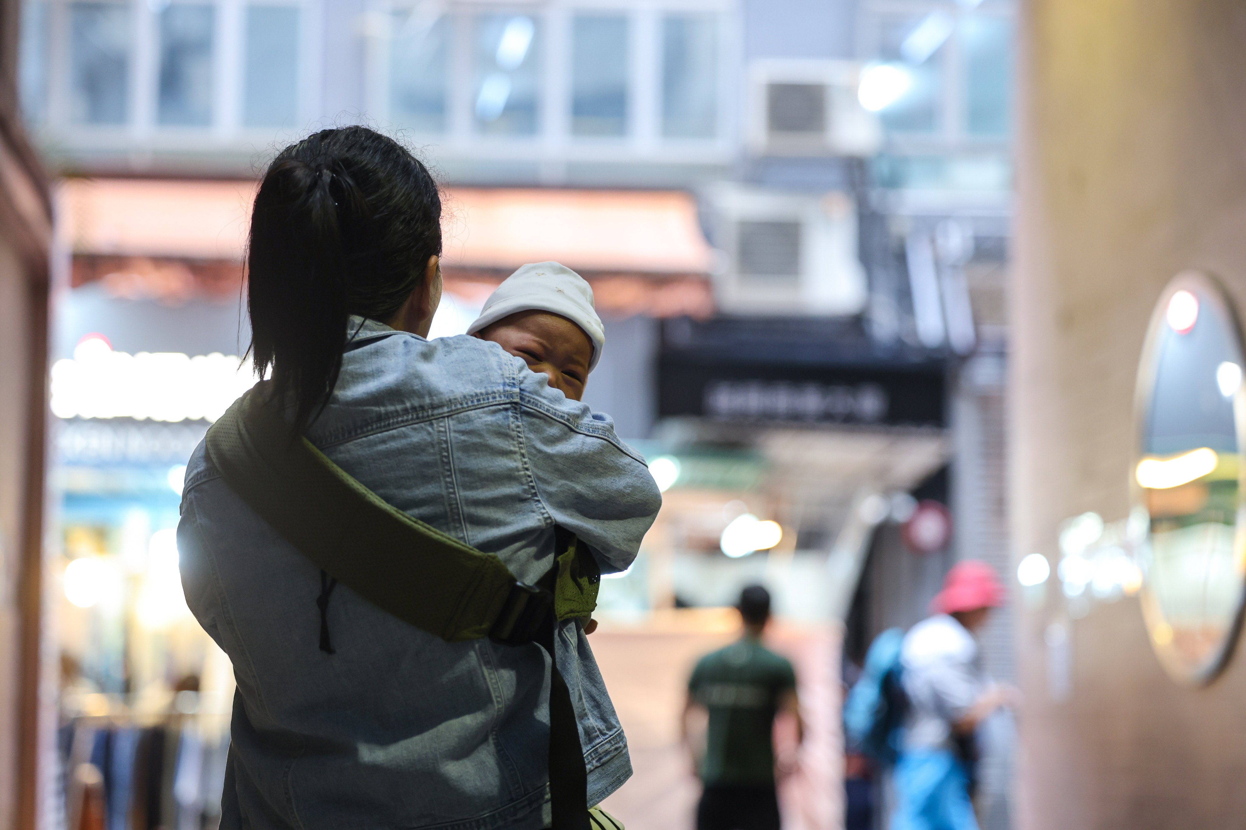 A domestic helper with her baby boy in Central, Hong Kong.Photo: Edmond So