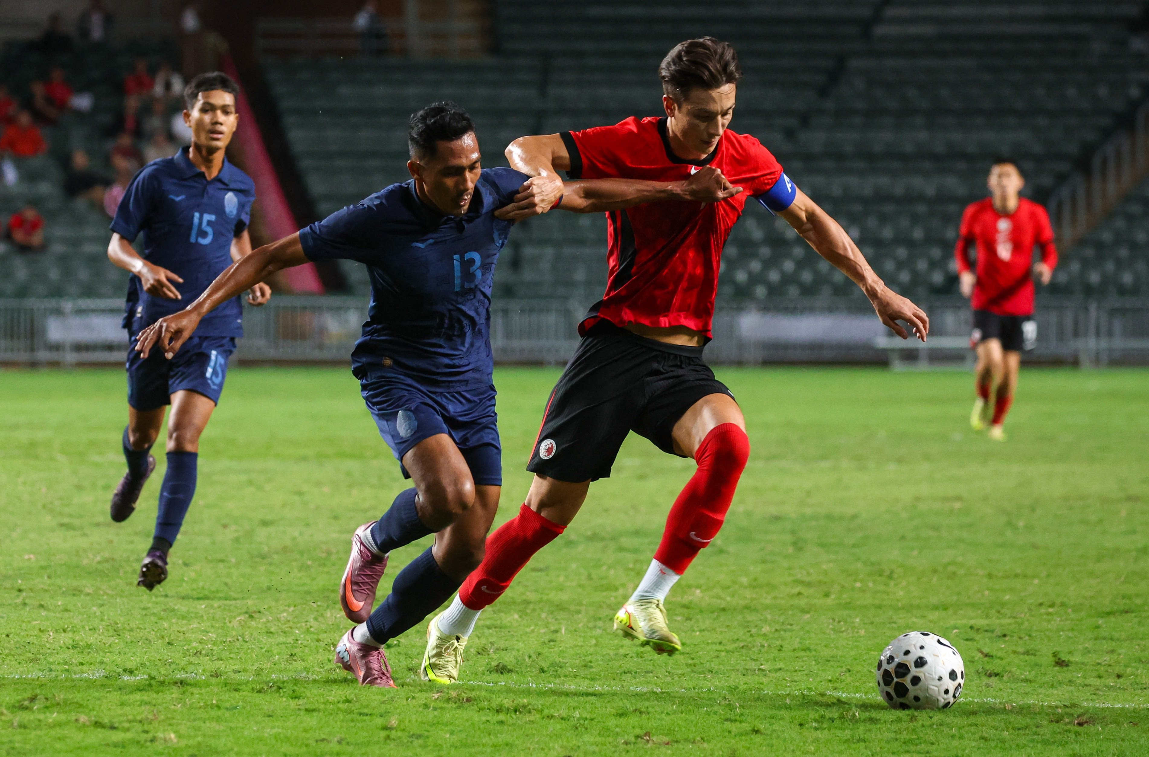 Matt Orr fends off Krya Saret during Hong Kong’s 1-1 draw with Cambodia. Photo: Edmond So