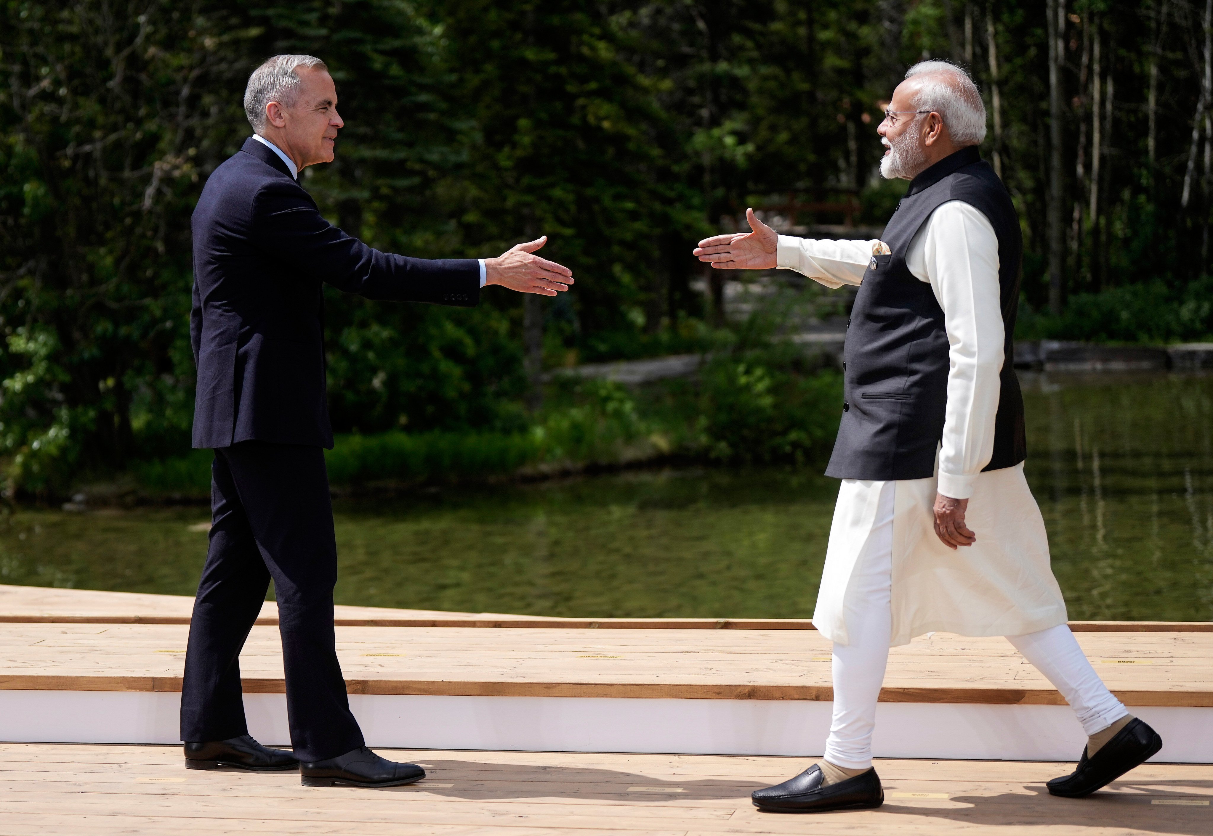 Canada’s Prime Minister Mark Carney (left) and his Indian counterpart Narendra Modi reach to shake hands as during the G7 summit in Kananaskis, Alberta, in June, where both countries restored high-level talks. Photo: The Canadian Press via AP