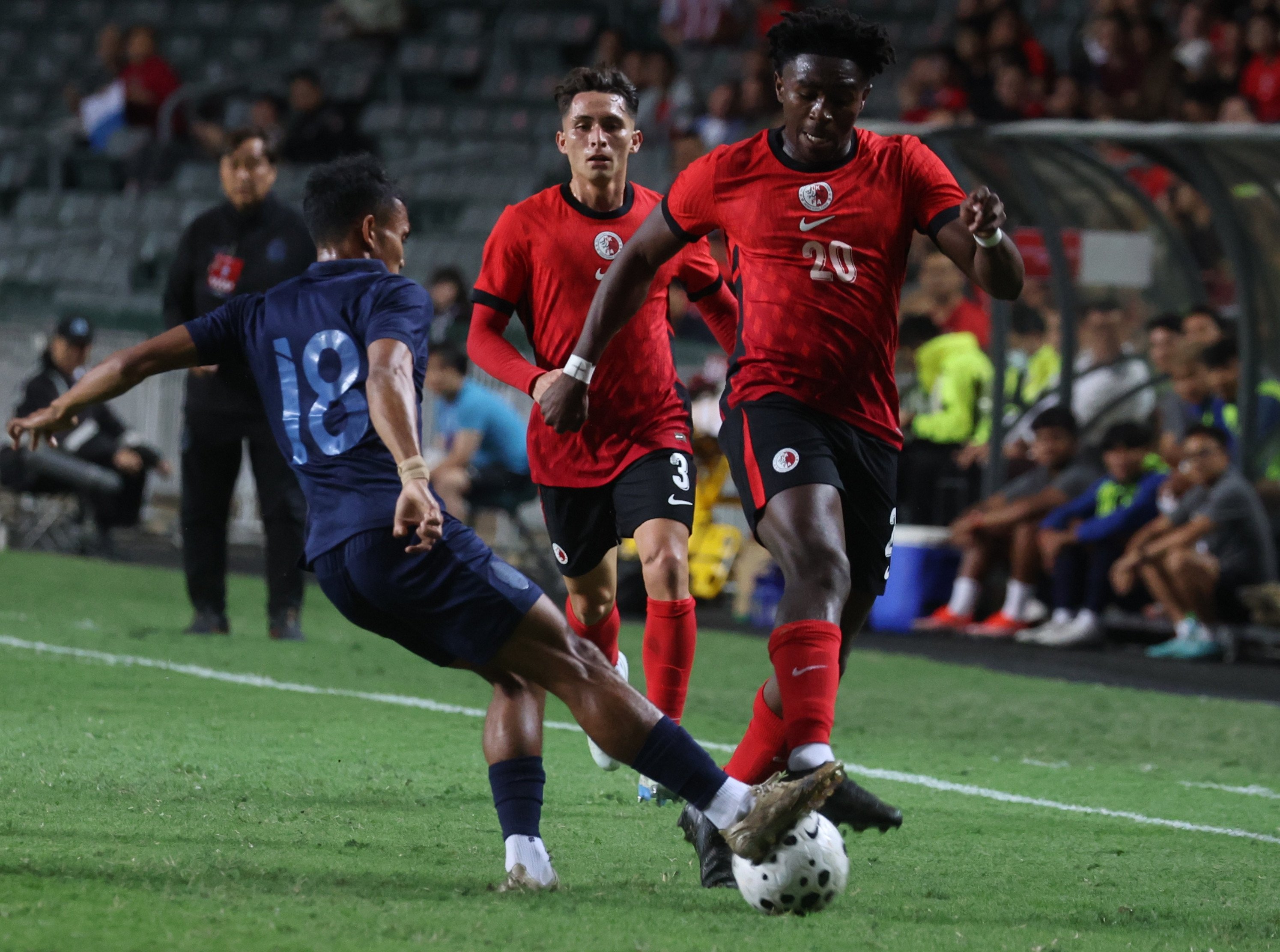 Michael Udebuluzor (right) in action during Hong Kong’s 1-1 draw with Cambodia on Thursday. Photo: Edmond So
