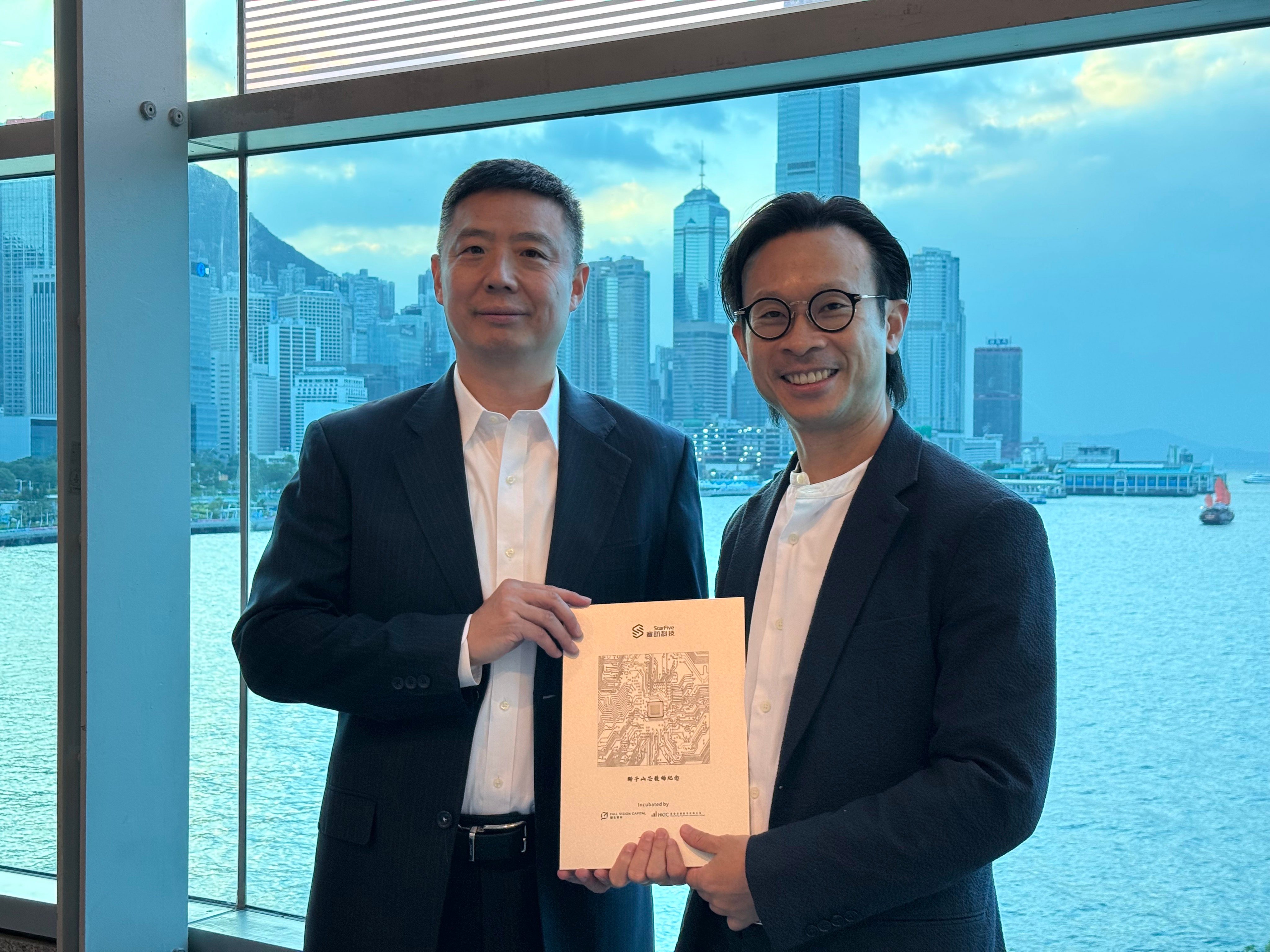 StarFive founder and CEO Thomas Xu (left) and Full Vision Capital managing partner Alan Chan hold a Lion Rock RISC-V chip in Hong Kong on November 14, 2025. Photo: Xinmei Shen