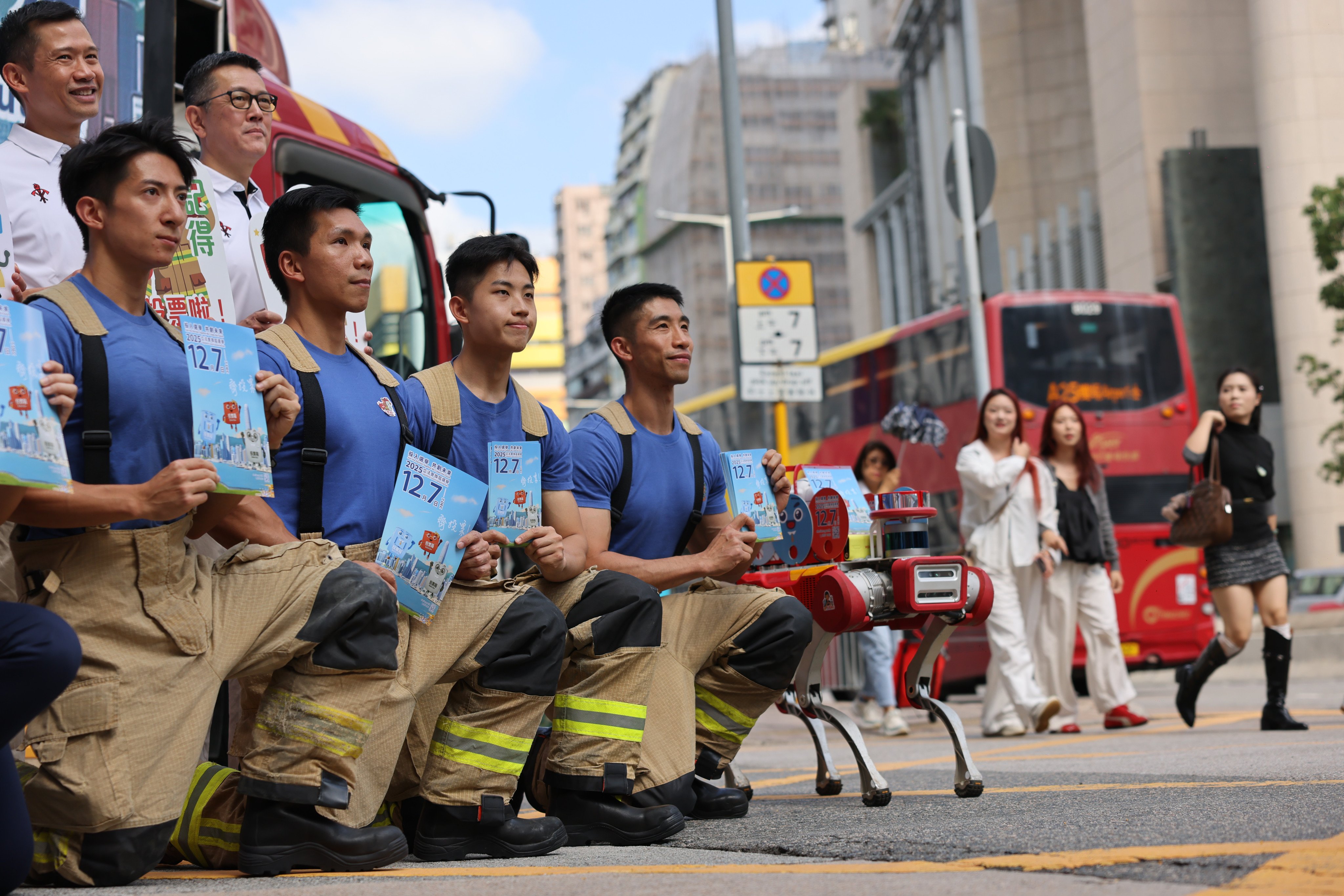 On November 8, firefighters distribute leaflets outside Tsim Sha Tsui fire station, calling on members of the public to vote in the Legco elections on December 7. Photo: Nora Tam
