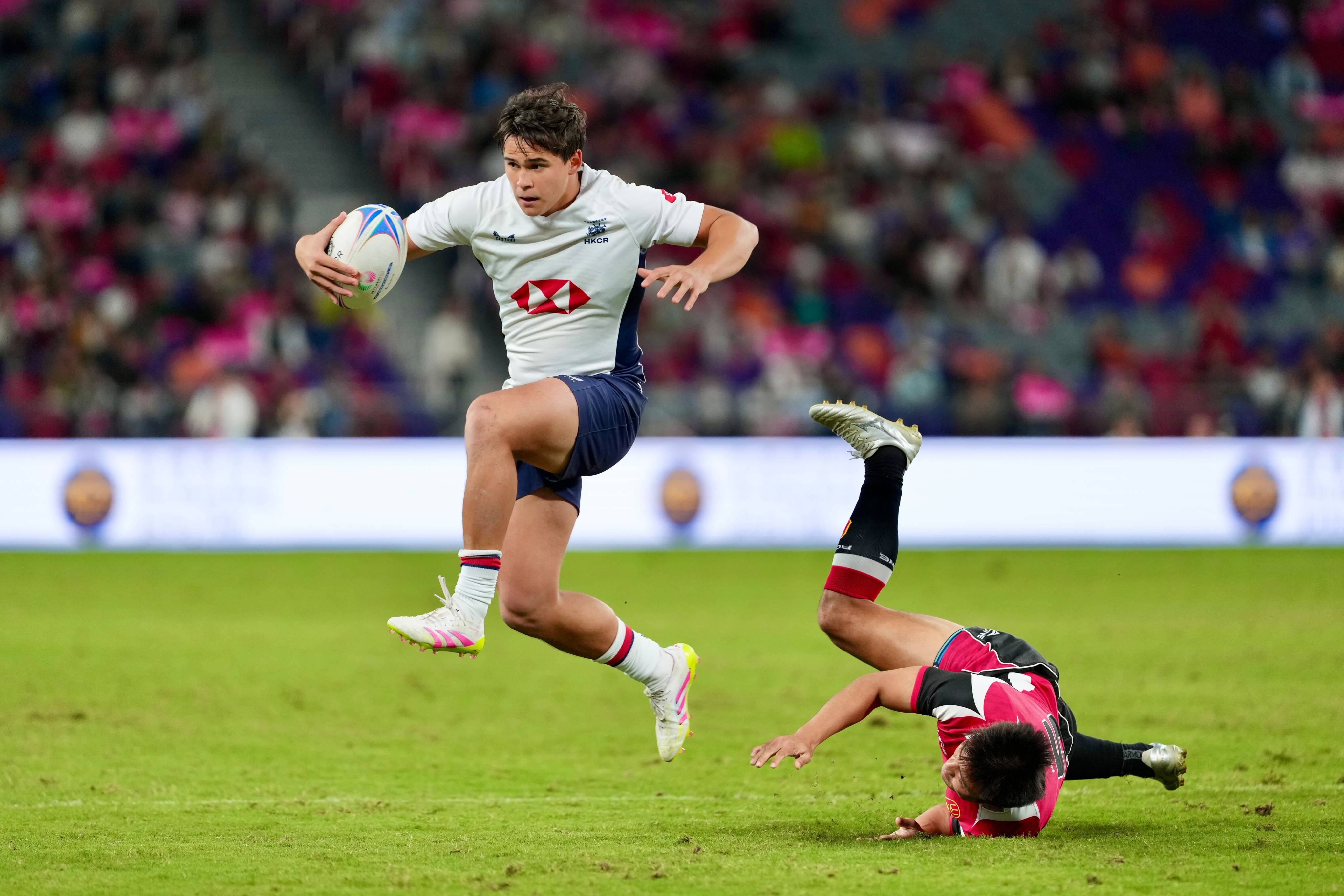 Julien Bourron scores the breakthrough try for Hong Kong in the rugby sevens final at Kai Tak Stadium. Photo: Sam Tsang