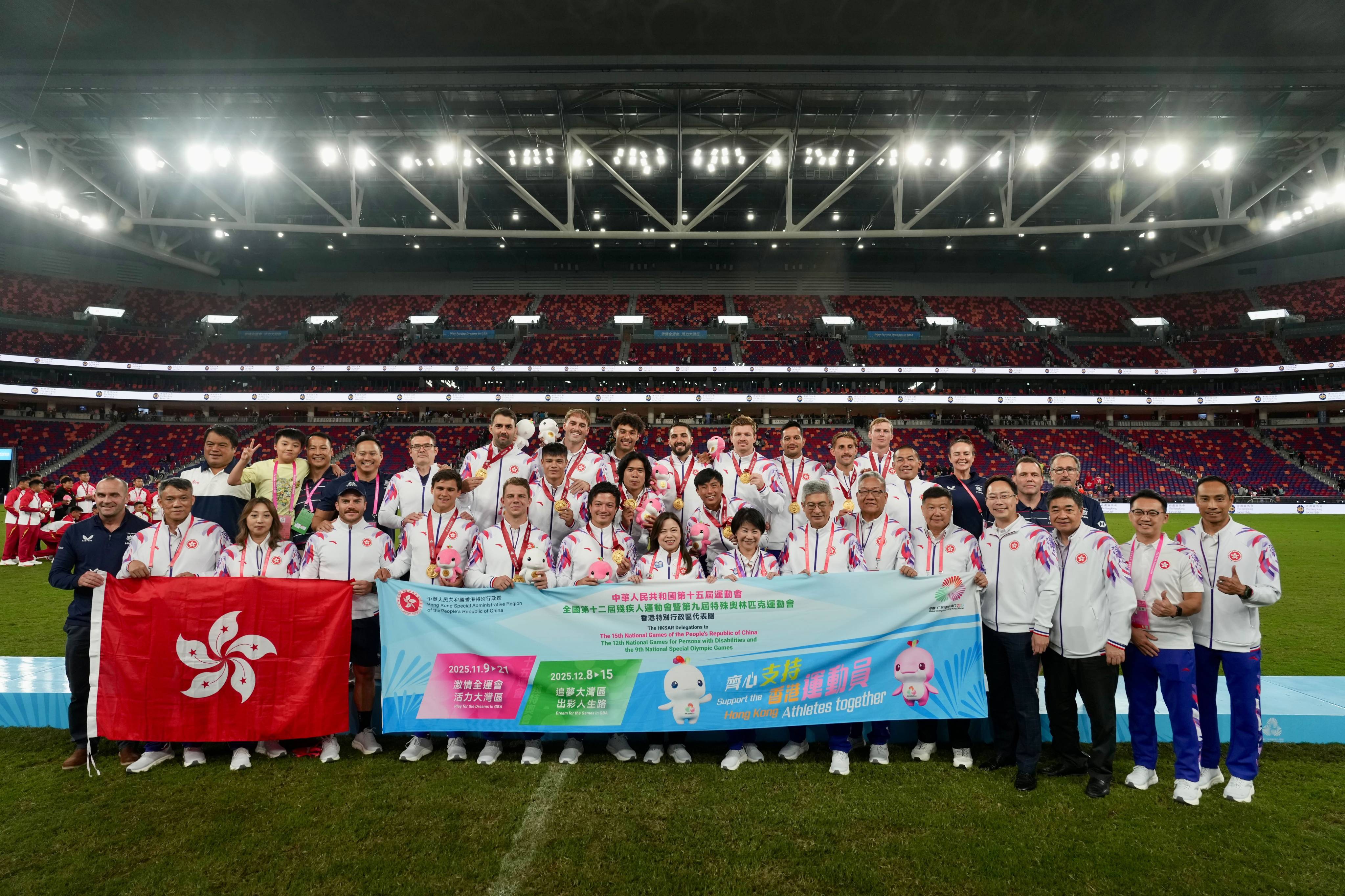 Hong Kong’s rugby sevens players pose with Rosanna Law Shuk-pui (front, centre), the sports minister and chef de mission of the city’s delegation, after they clinched National Games gold at Kai Tak Stadium. Photo: Sam Tsang